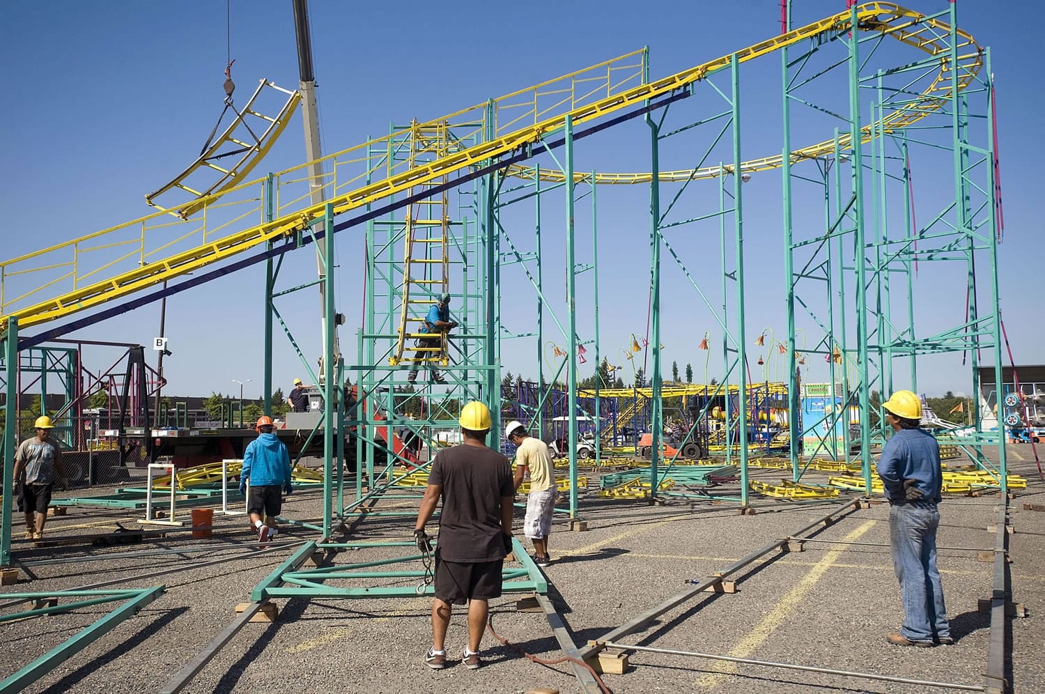 Workers assemble The Zillerator on Wednesday at the Clark County Fairgrounds, where the 10-day fair starts Friday and will likely draw more than 250,000 people.