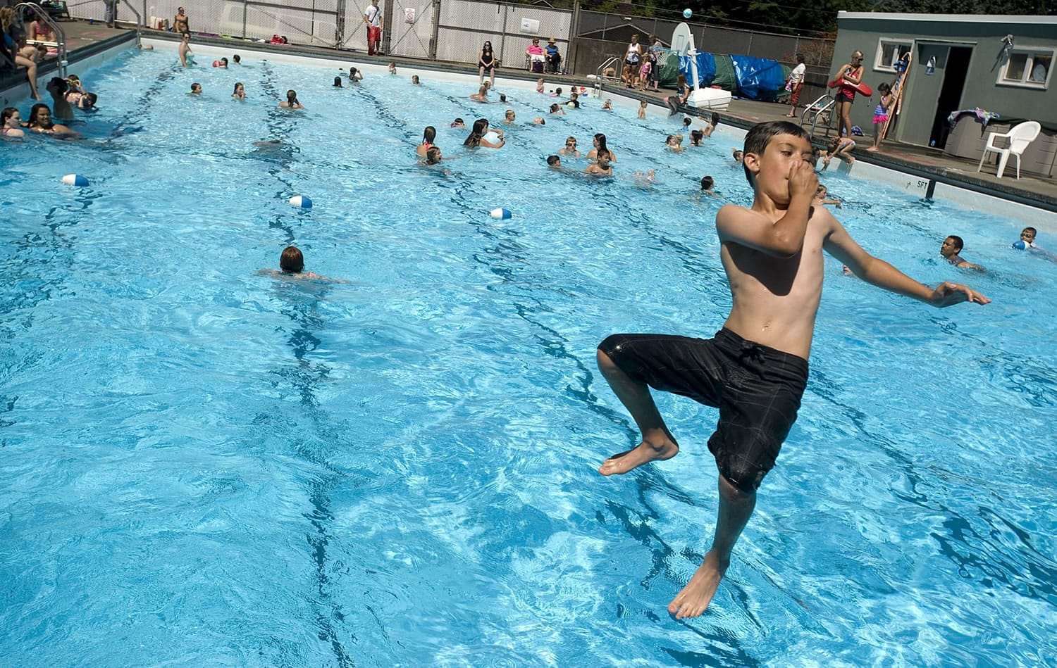 Teo Echeverio, 10, of Camas prepares to splash into the Camas Swimming Pool on Wednesday afternoon.