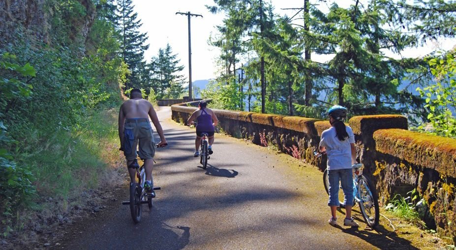Bicyclers pedal up the Tooth Rock viaduct portion of the Historic Columbia River Highway State Trail near Bonneville Dam.