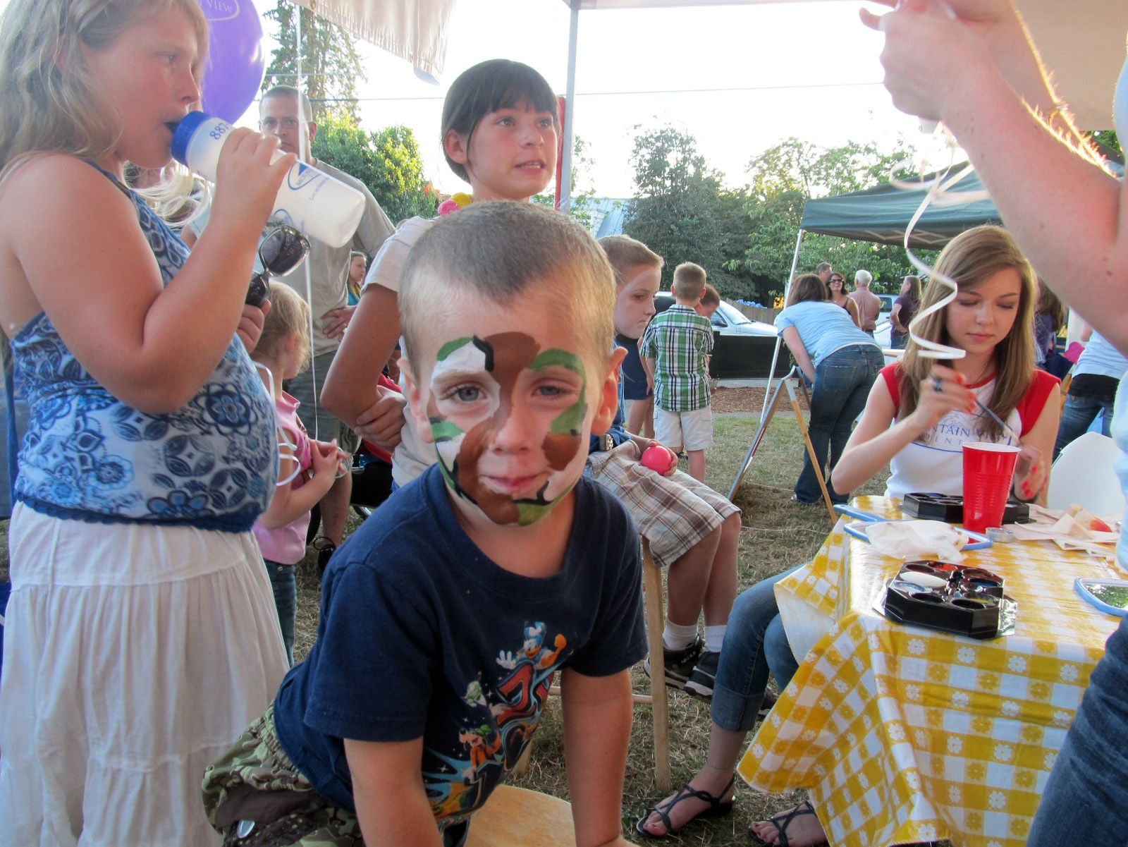 Ridgefield: Bryson Scanapico, 3, gets his face painted during Ridgefield's 7th annual National Night Out celebration.