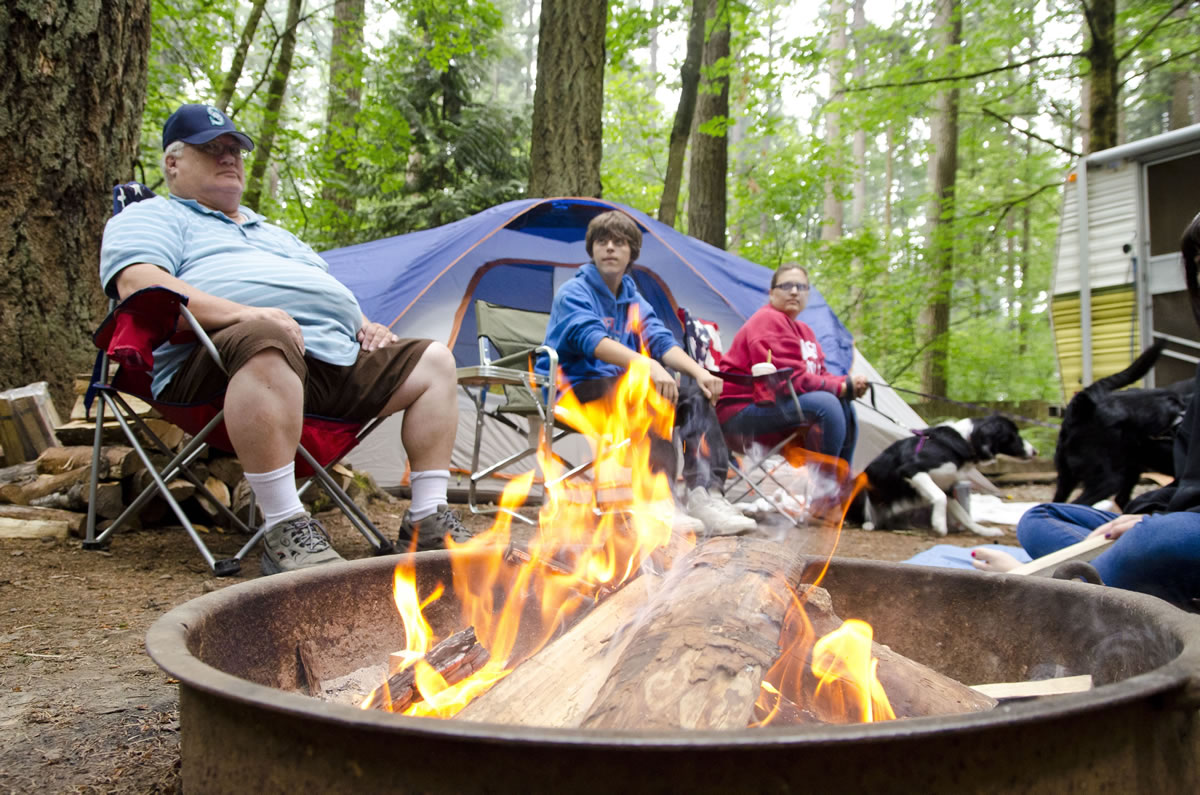 Ridgefield resident Frank Matlock, left, camps with his family at the Battle Ground Lake campsite.