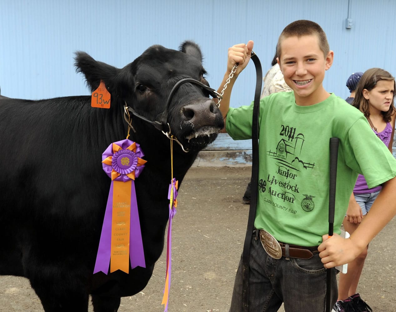 Bill Martin gets 2011 grand champion Joseph ready for showing at the Junior Livestock Auction.
