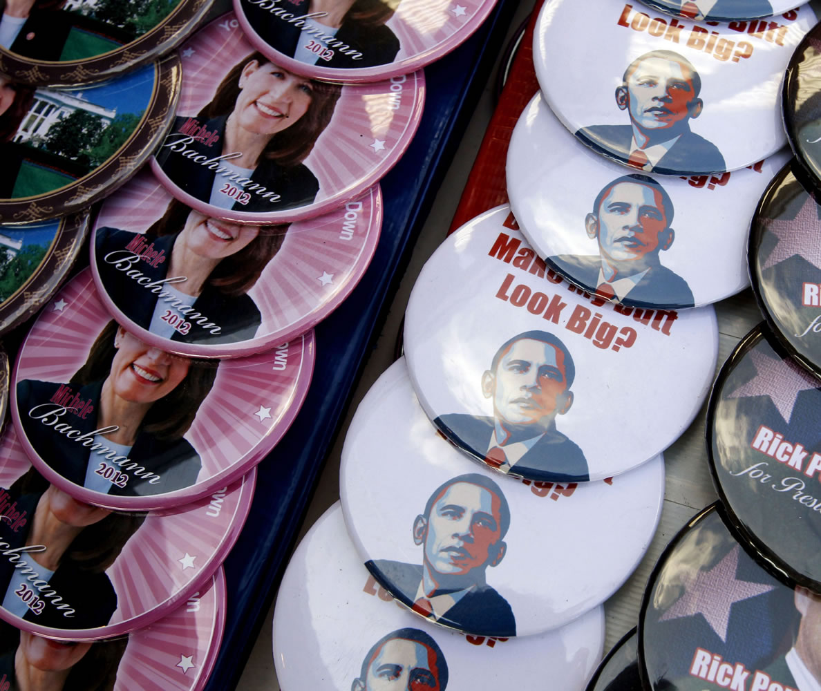 Campaign buttons for Republican presidential candidates Rep. Michele Bachmann, R-Minn., left, and Texas Gov.