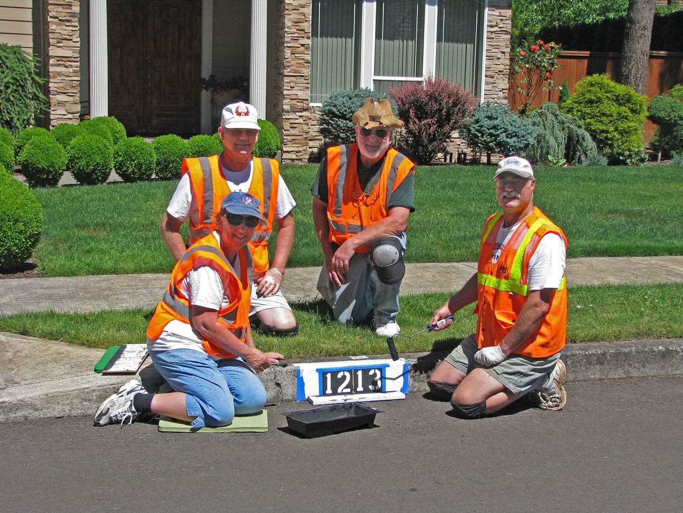 Tom Harriman, Gene Wigglesworth and Dennis Wieder painted house numbers in front of more than 250 homes.