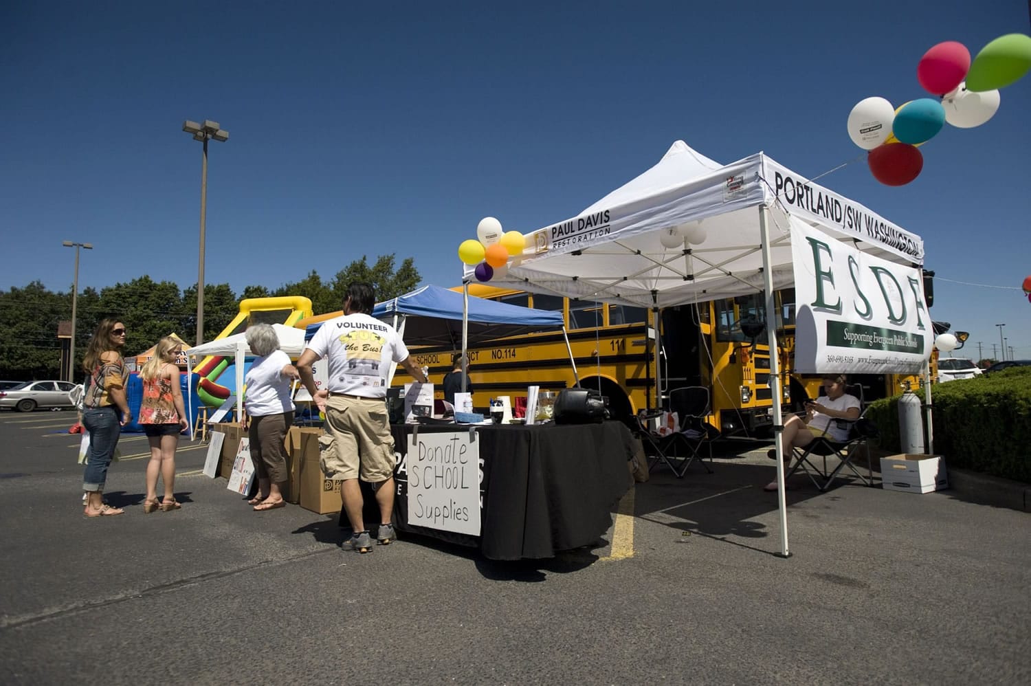 The Evergreen School District Foundation accepted school supplies or cash donations at its inaugural &quot;Stuff the Bus&quot; event on Wednesday. Volunteers and two large buses parked between Chuck's Produce and McDonald's, at 13215 E.