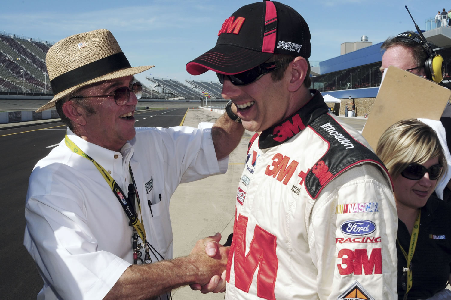 Greg Biffle, right, is congratulated by team owner Jack Roush, left, after winning the pole during qualifications Friday for the NASCAR Sprint Cup Series auto race at Michigan international Speedway on Sunday.