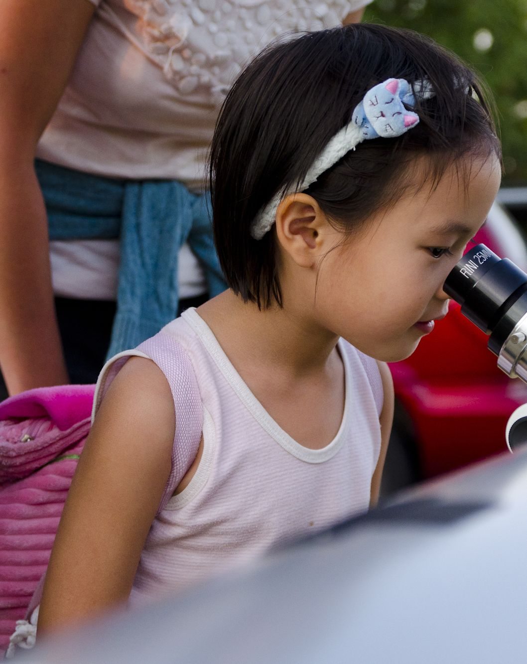 Rora Te, 5, looks through a telescope to see some trees before the start of the Perseid meteor shower at Rooster Rock State Park.