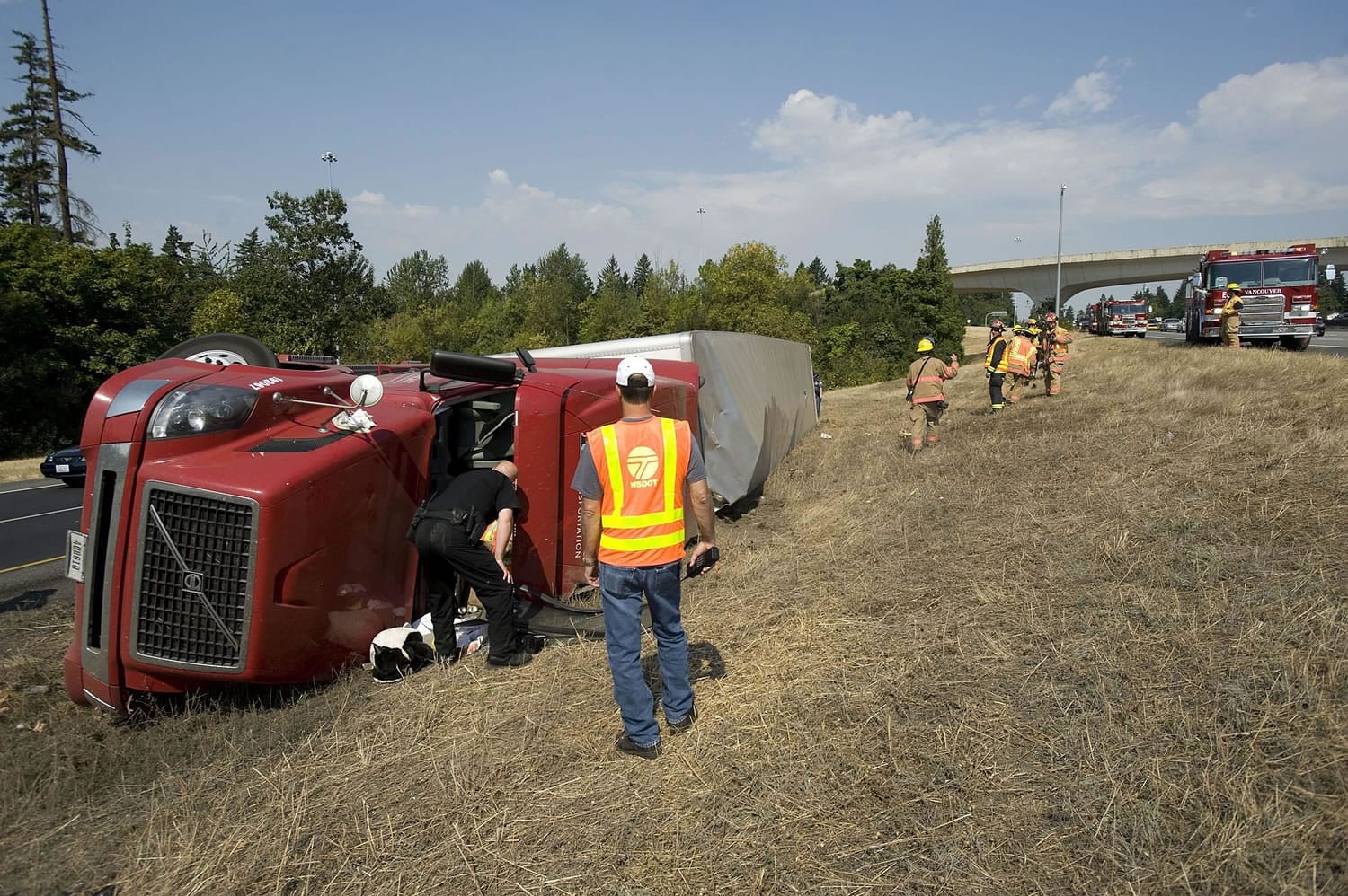 This semi-truck rolled as it exited SR 14 eastbound to I-205 southbound about 11:45 a.m.