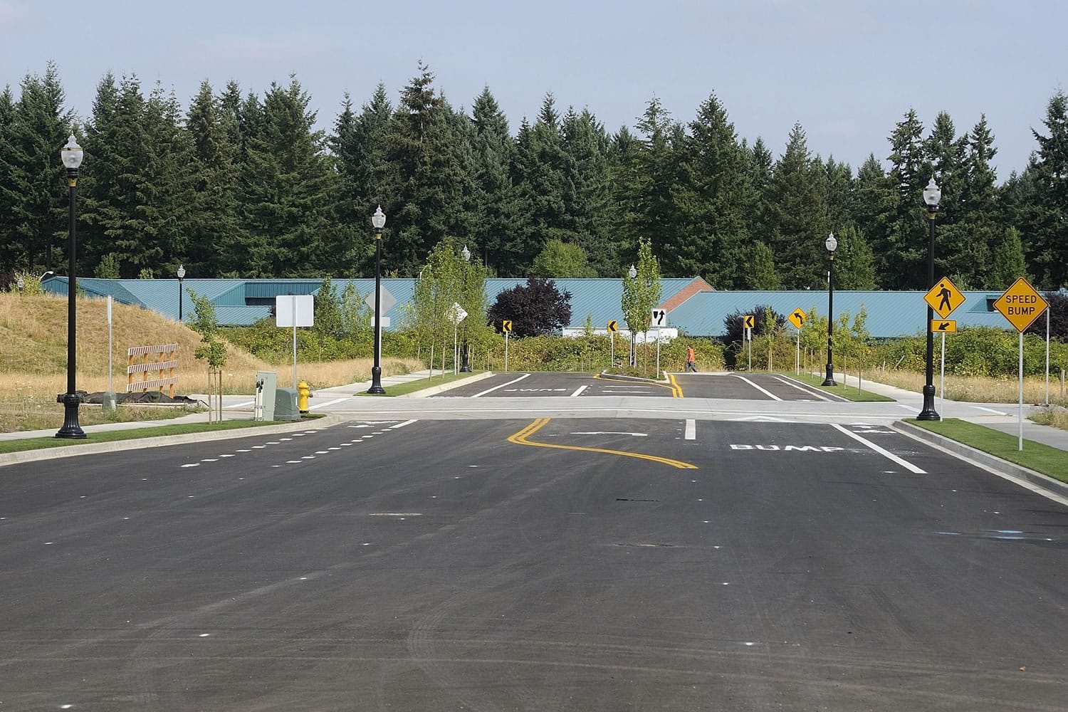 Olympia Drive now cuts north through the former Evergreen Airport site, as owners launch recruiting efforts in the hopes of attracting retail stores to anchor The Landing shopping center.