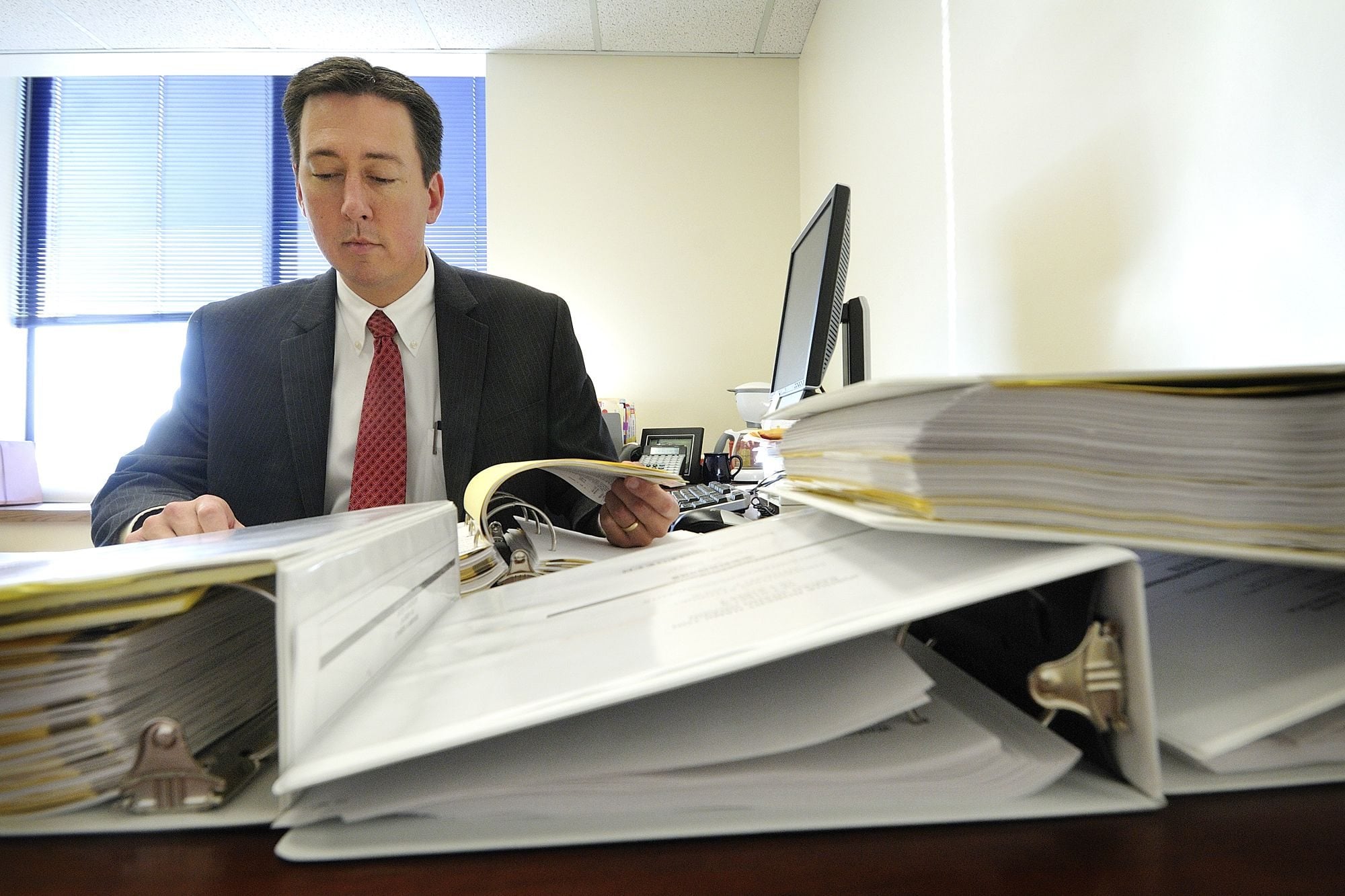 Tony Golik reviews cases in his office a day after winning the Clark County prosecutor race last November.