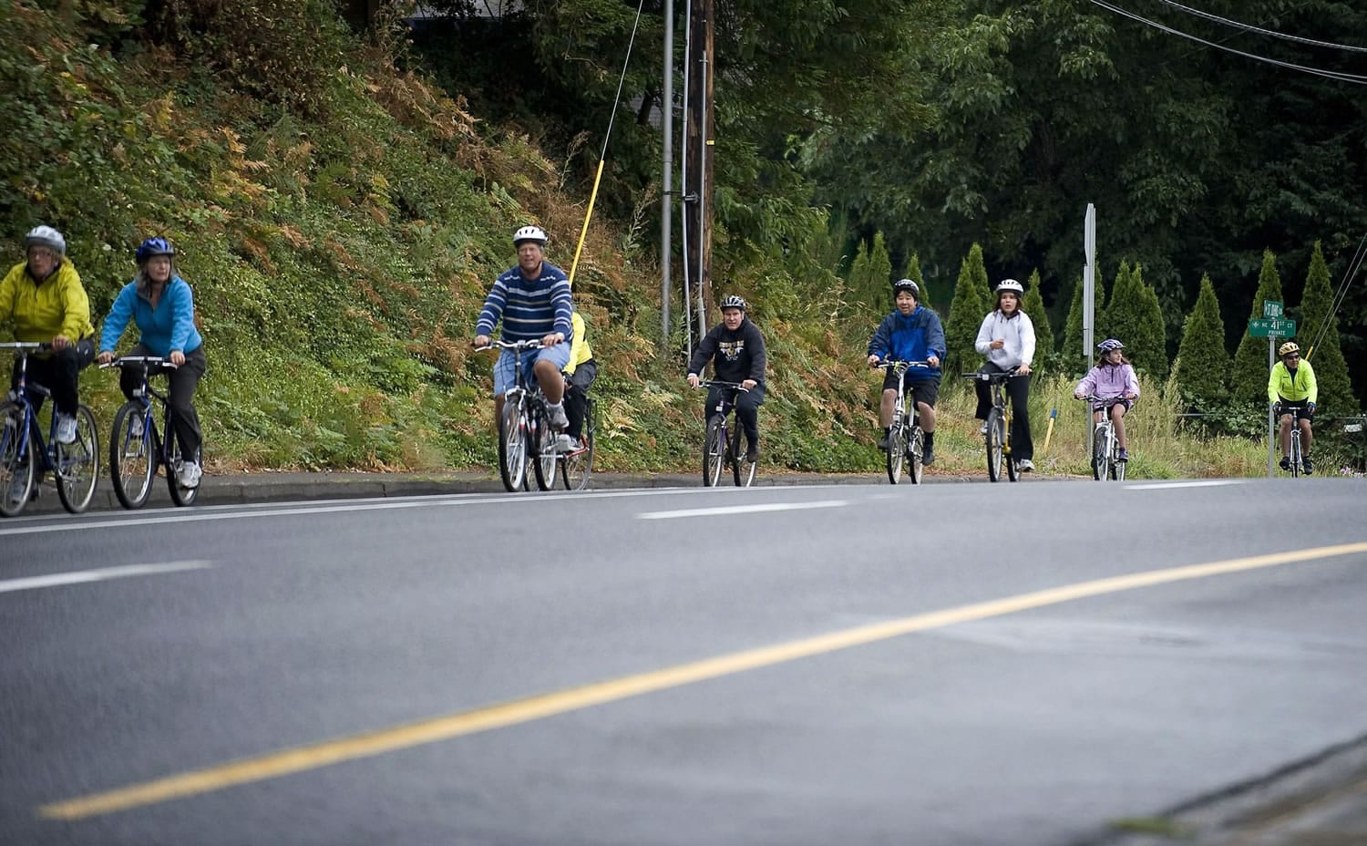 Participants in Saturday's Gordon Patterson Memorial Bike Ride head north on Northeast St.