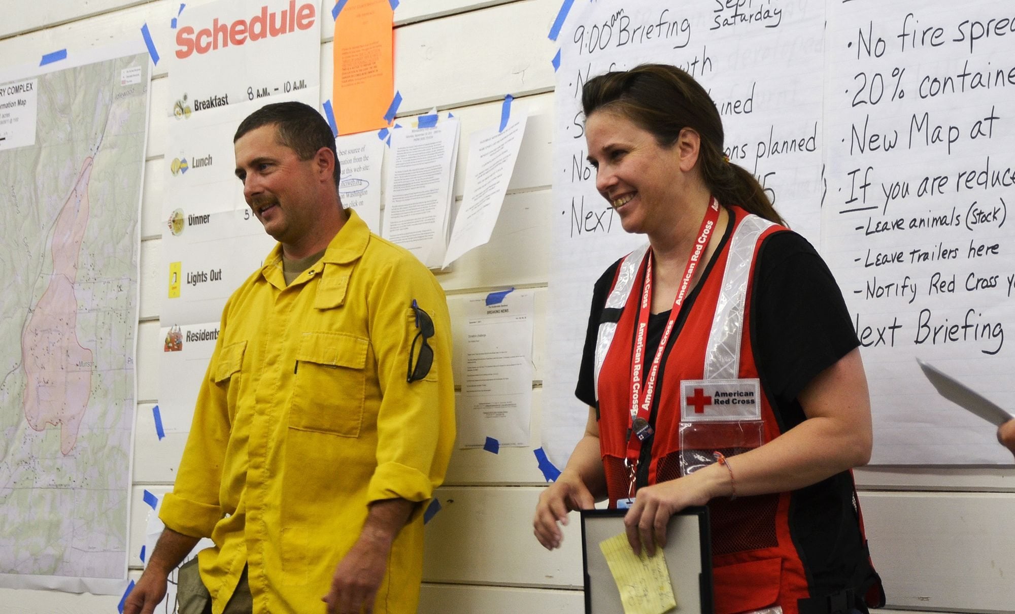 Fourth Plain Village: Dave LaFave, incident team commander and fire chief for Cowlitz 2 Fire and Rescue in Kelso, left, offered Kelly Anderson, director of Emergency Services for the Southwest Washington chapter of the American Red Cross, the Excellence in Service Award on Sept.
