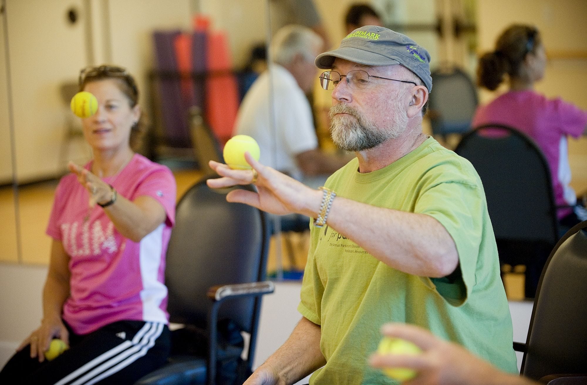 Dan Maxwell uses a tennis ball to improve hand dexterity during a class at the Waterford at Fairway Village Tuesday. Maxwell, who has Parkinson's disease, advocated for exercise classes for people with movement disorders a year and a half ago.