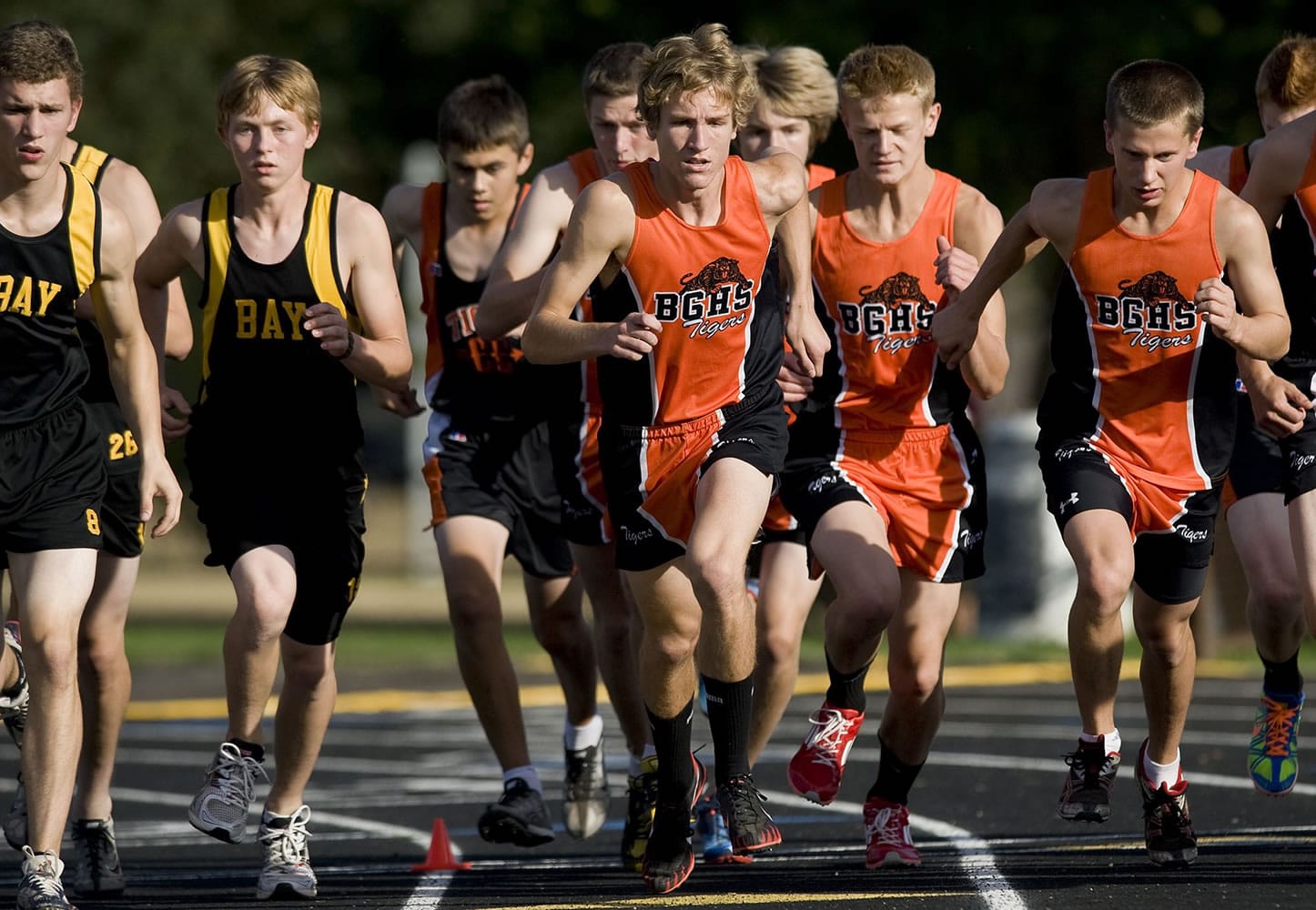 Battle Ground's Mark Tedder, center, leads his team out from the starting line during a recent cross country race at Hudson's Bay High.