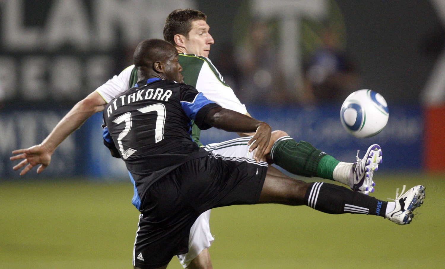 San Jose's Nana Attakora (27) defends against Portland's Kenny Cooper in the first half Wednesday.