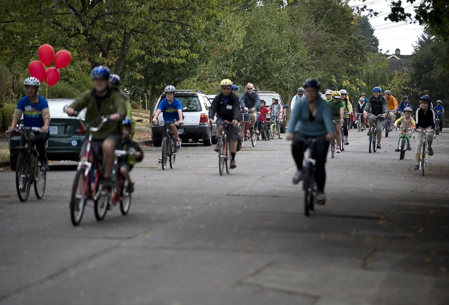 Clark County residents, including members of the county's Youth Commission, ride north on Northeast 17th Avenue in Portland while participating in a Sunday Parkways ride. The event closes streets to vehicles as a way to encourage people to explore their neighborhoods.