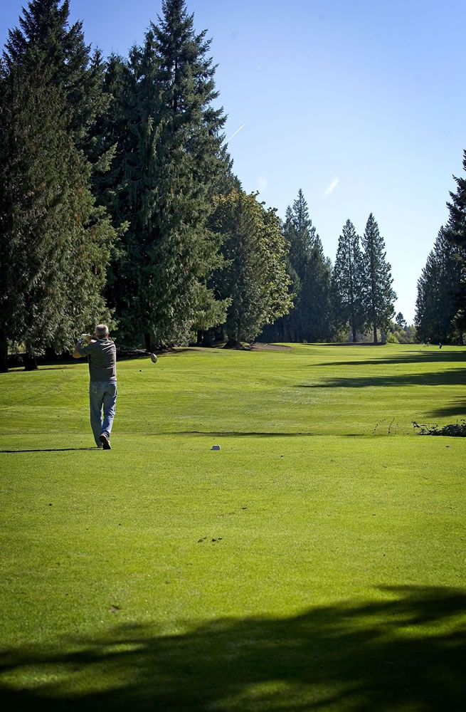 Jerry Anderson of Vancouver drives the ball off the 18th tee Wednesday at The Cedars on Salmon Creek golf course in Brush Prairie.
