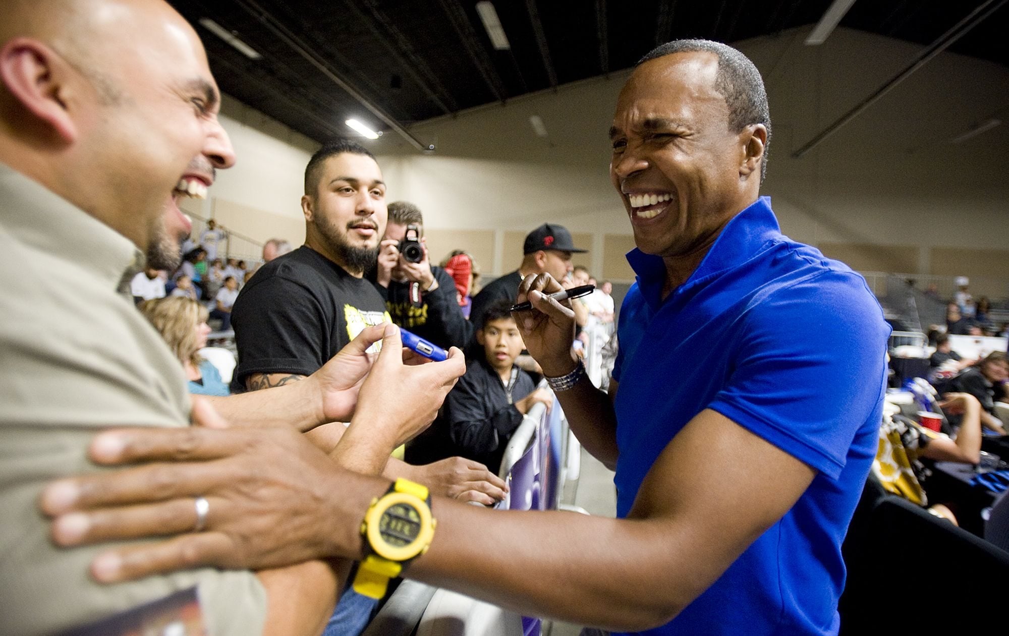 Boxing legend Sugar Ray Leonard greets fans and signs autographs Saturday at the Vancouver PAL Fight Night at the Clark County Event Center.