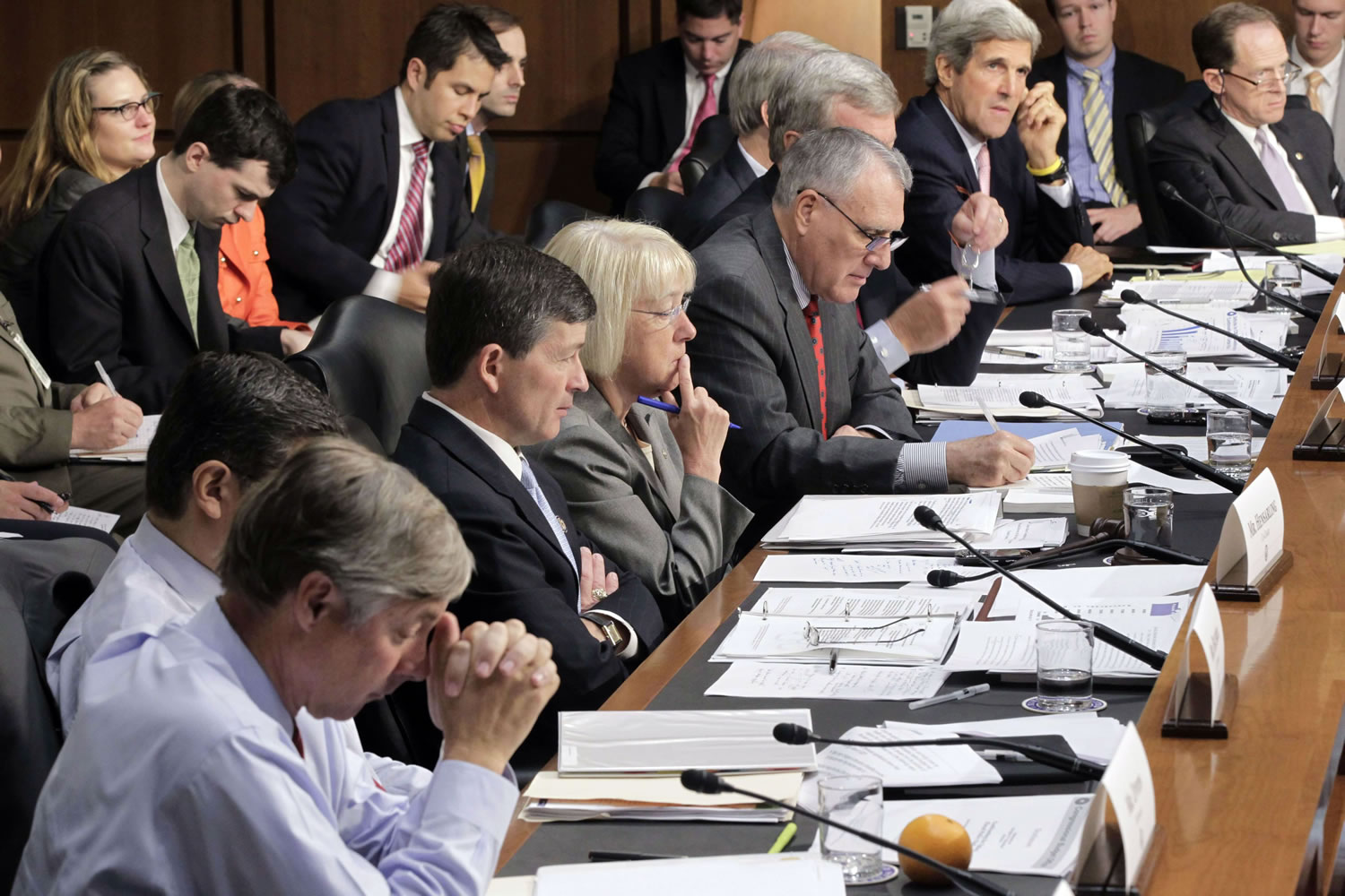 In this Sept. 13, 2011, file photo, the Joint Select Committee on Deficit Reduction, led by co-chairs Rep. Jeb Hensarling, R-Texas, third from left, and Sen. Patty Murray, D-Wash., fourth from left, meets on Capitol Hill in Washington to hear testimony about the national debt from the Congressional budget director. After weeks of secret meetings the supercommittee seems no closer to reaching its assigned goal of at least $1.2 trillion in deficit savings over the next 10 years than it was when talks began.
