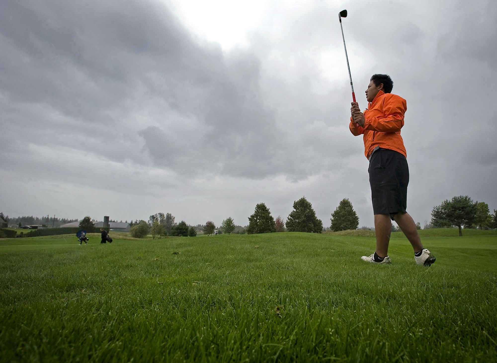 Heritage's Nick Regalado didn't let Tuesday's threatening skies keep him from wearing shorts at the Class 4A district golf tournament at Tri-Mountain Golf Course in Ridgefield.