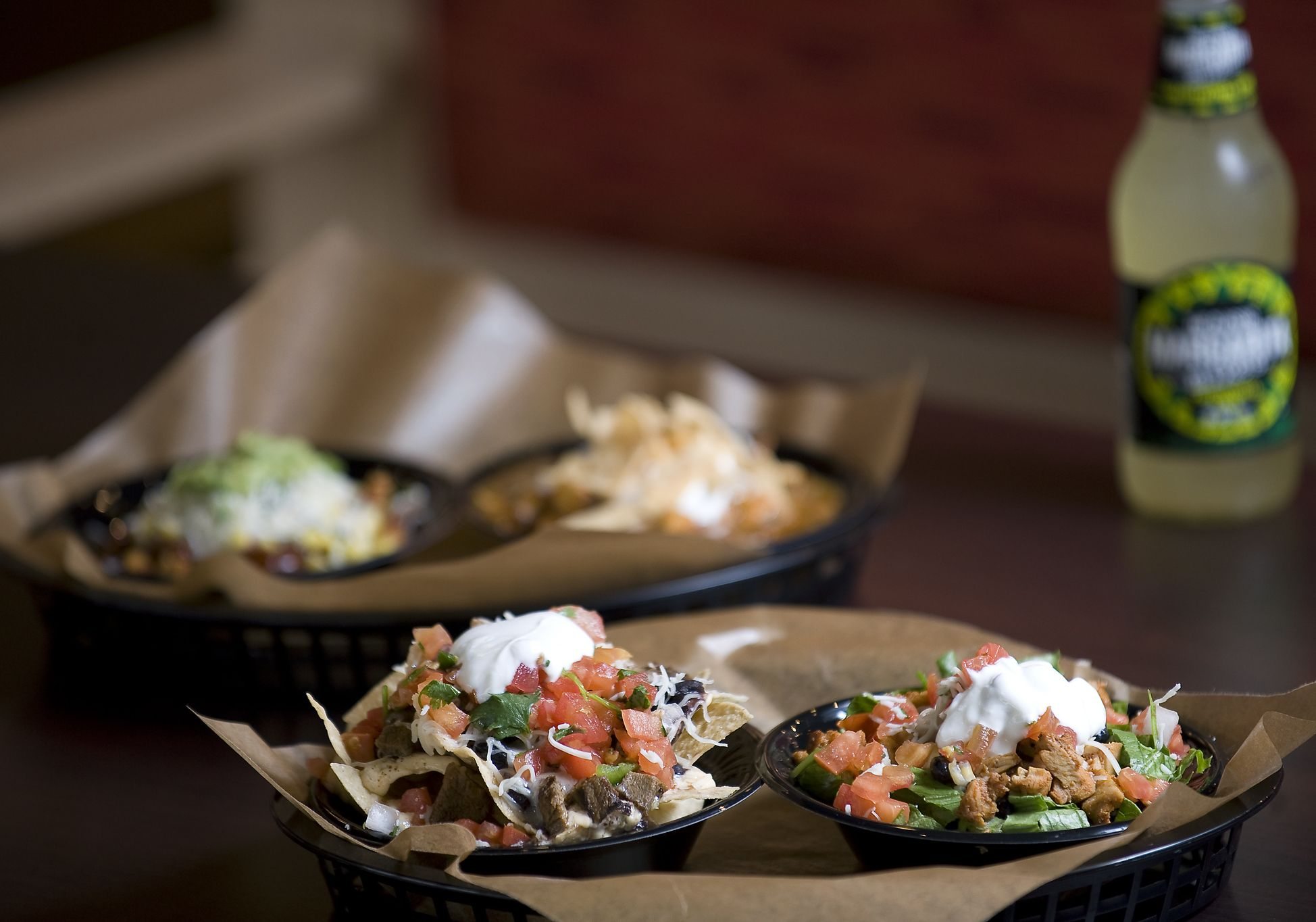 The 3-Cheese Nachos with Pulled Pork and a Taco Salad with Grilled Steak are among the many offerings at Qdoba's first Washington location, in Camas.