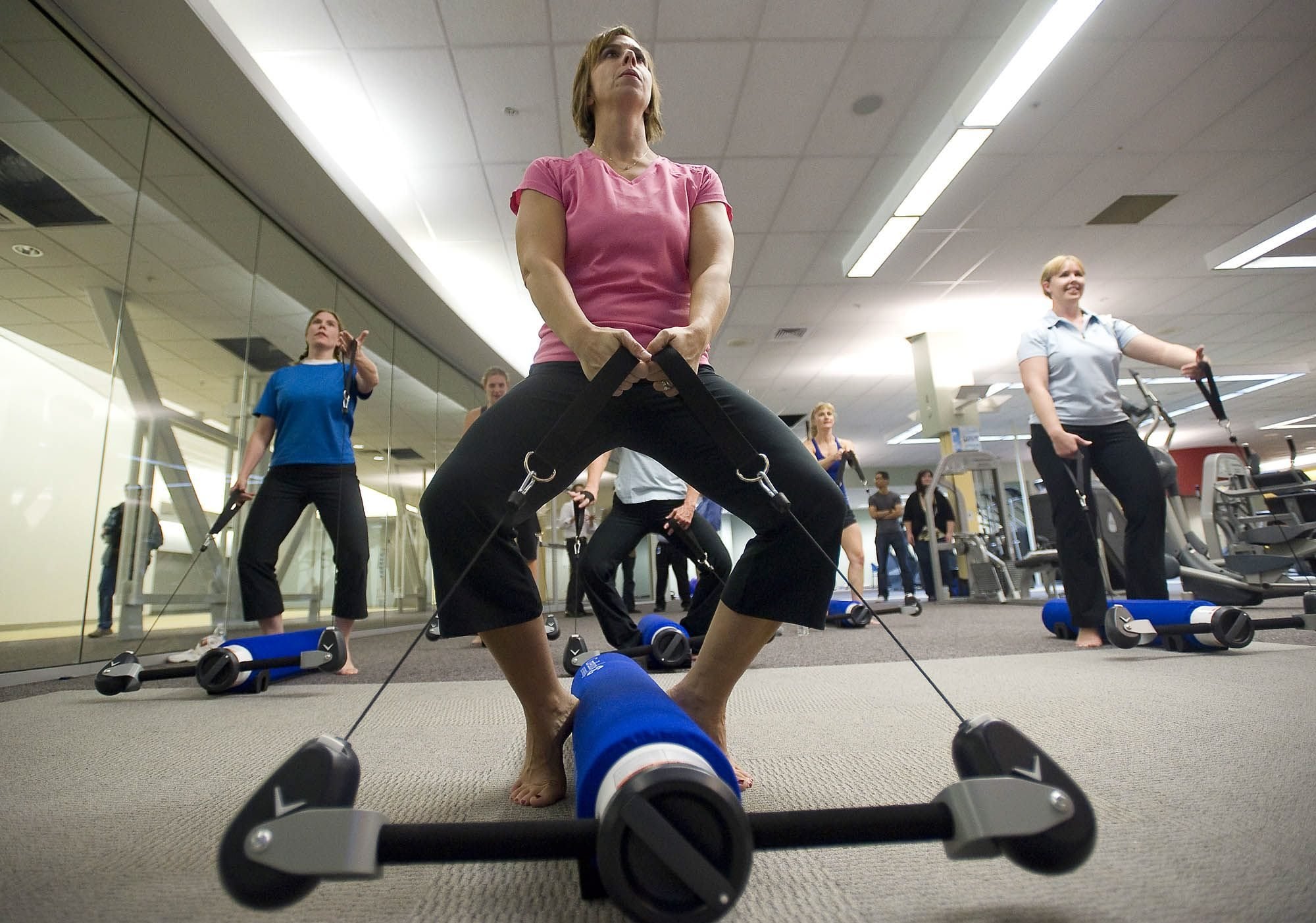 Jill Olafson, 41, works out with other Nautilus employees to familiarize themselves with the company's first new fitness product in several years: the CoreBody Reformer.