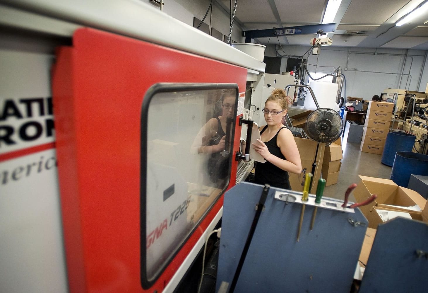 Machine operator Katrina West, 18, produces housings for humidifiers using injection molding.