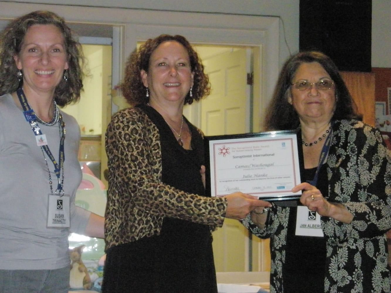 Soroptist International of Camas-Washougal president Susan Trinacty, left, presents Vida's Ark founder Julie Hanke the SICW Rudy Award with Jan Alberg.