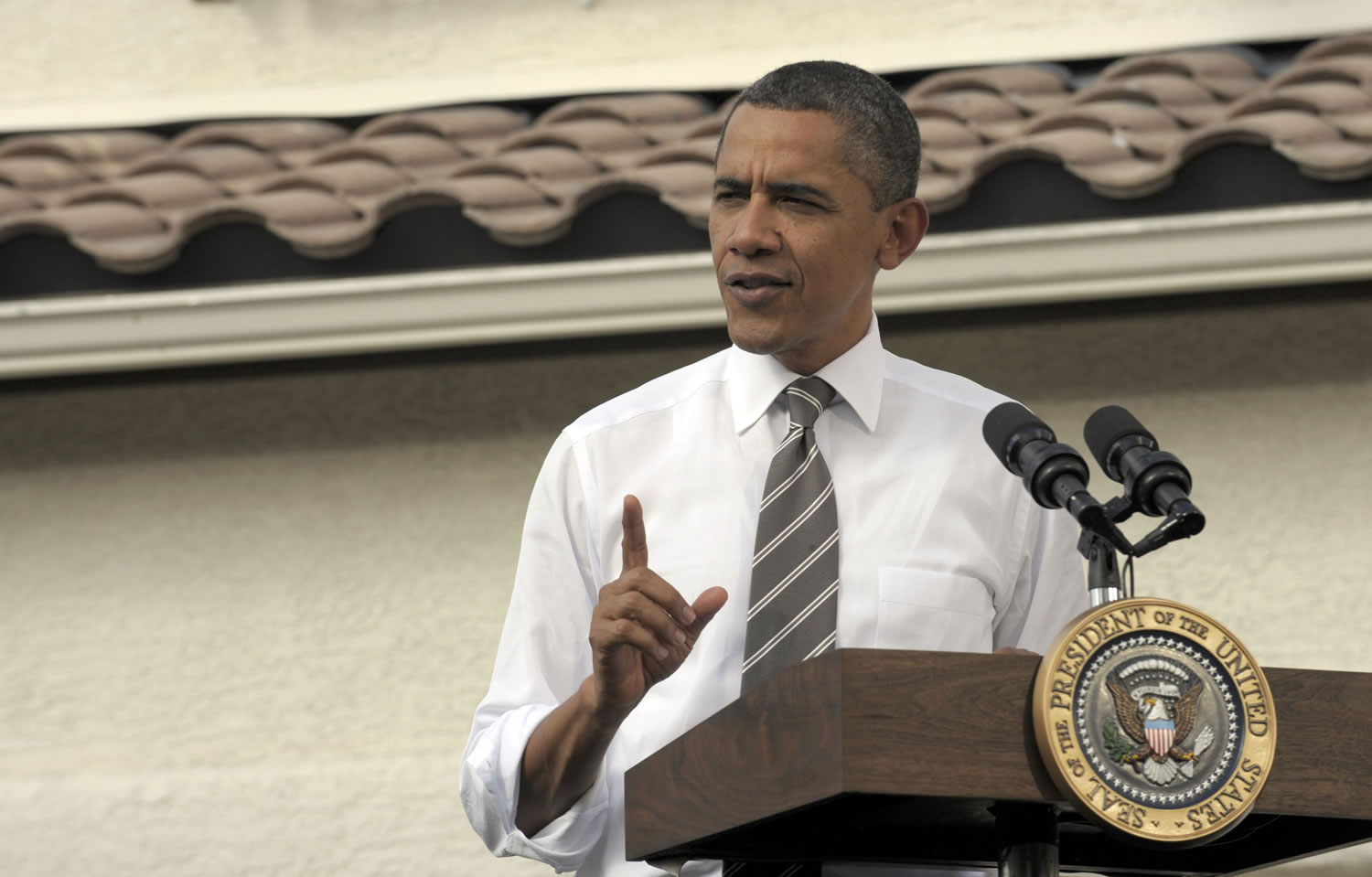 President Barack Obama speaks Monday outside of the home of Jose and Lissette Bonilla in Las Vegas.