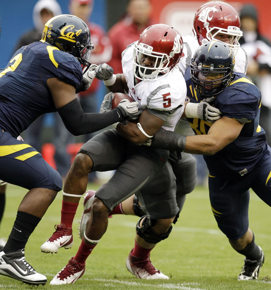 Washington State's Rickey Galvin (5) gained 73 yards on 12 carries, including a 5-yard touchdown run.