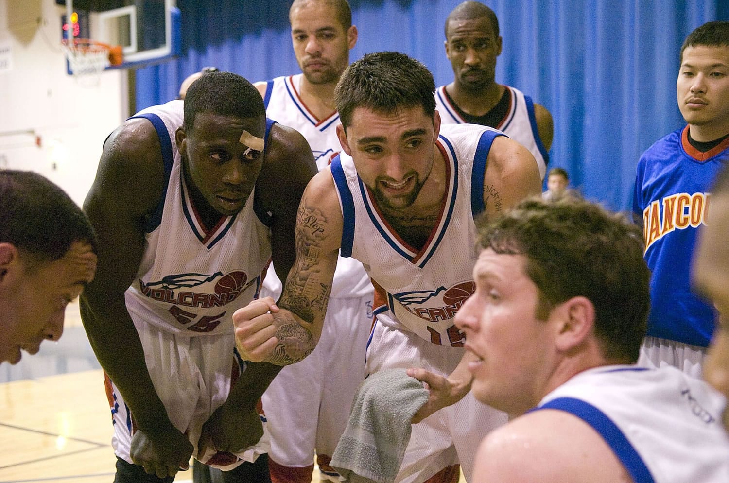 Alex Hartman, center, used his experience with the Vancouver Volcanoes to earns a shot at the NBA Development League.