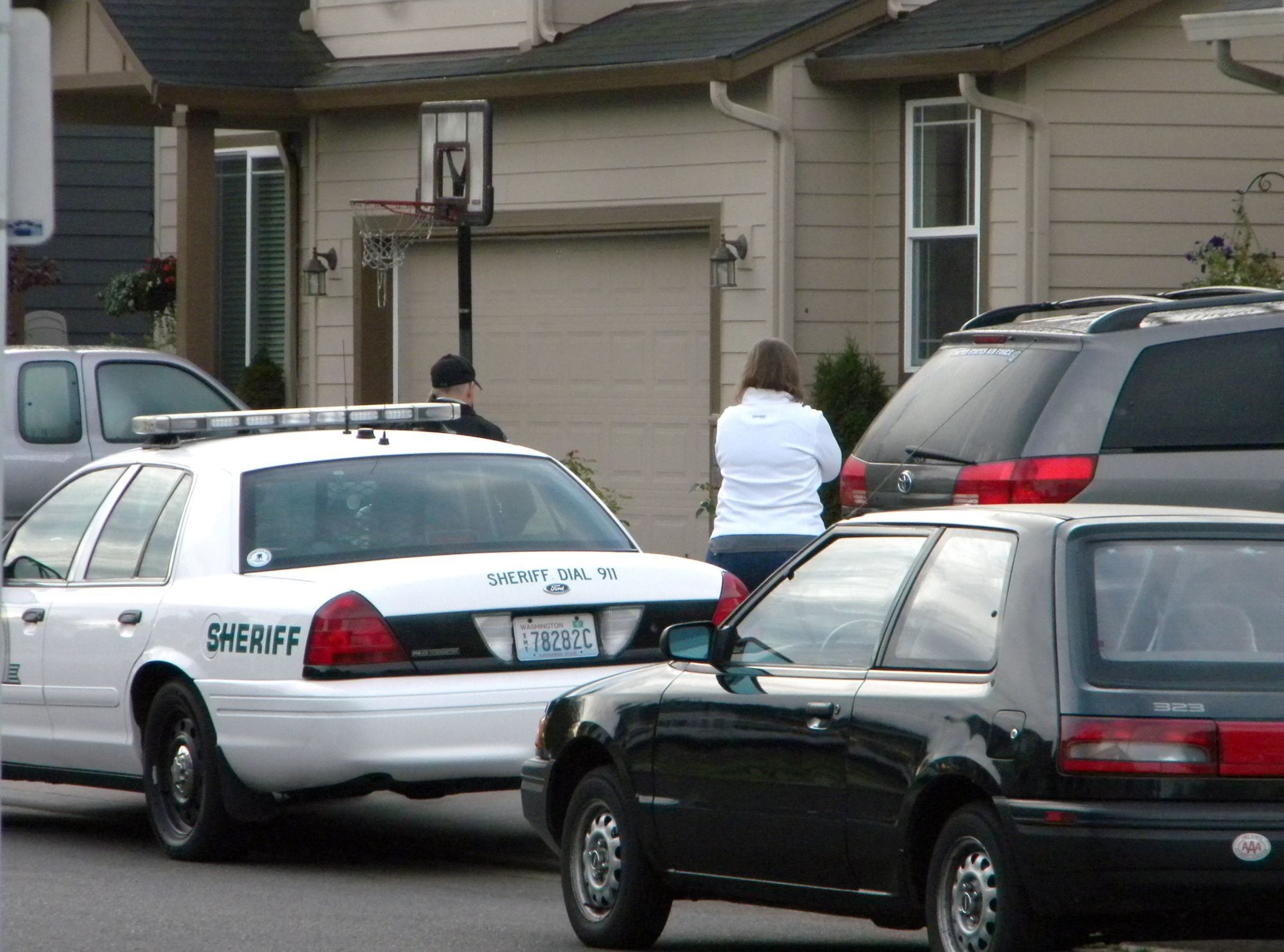 Police are pictured here responding to the Battle Ground home of Clark County sheriff's Detective Ed Owens on Sept. 15, 2010, a day after an accidental shooting there. Owens' 3-year-old son, Ryan, got ahold of his father's gun, accidentally shooting himself.