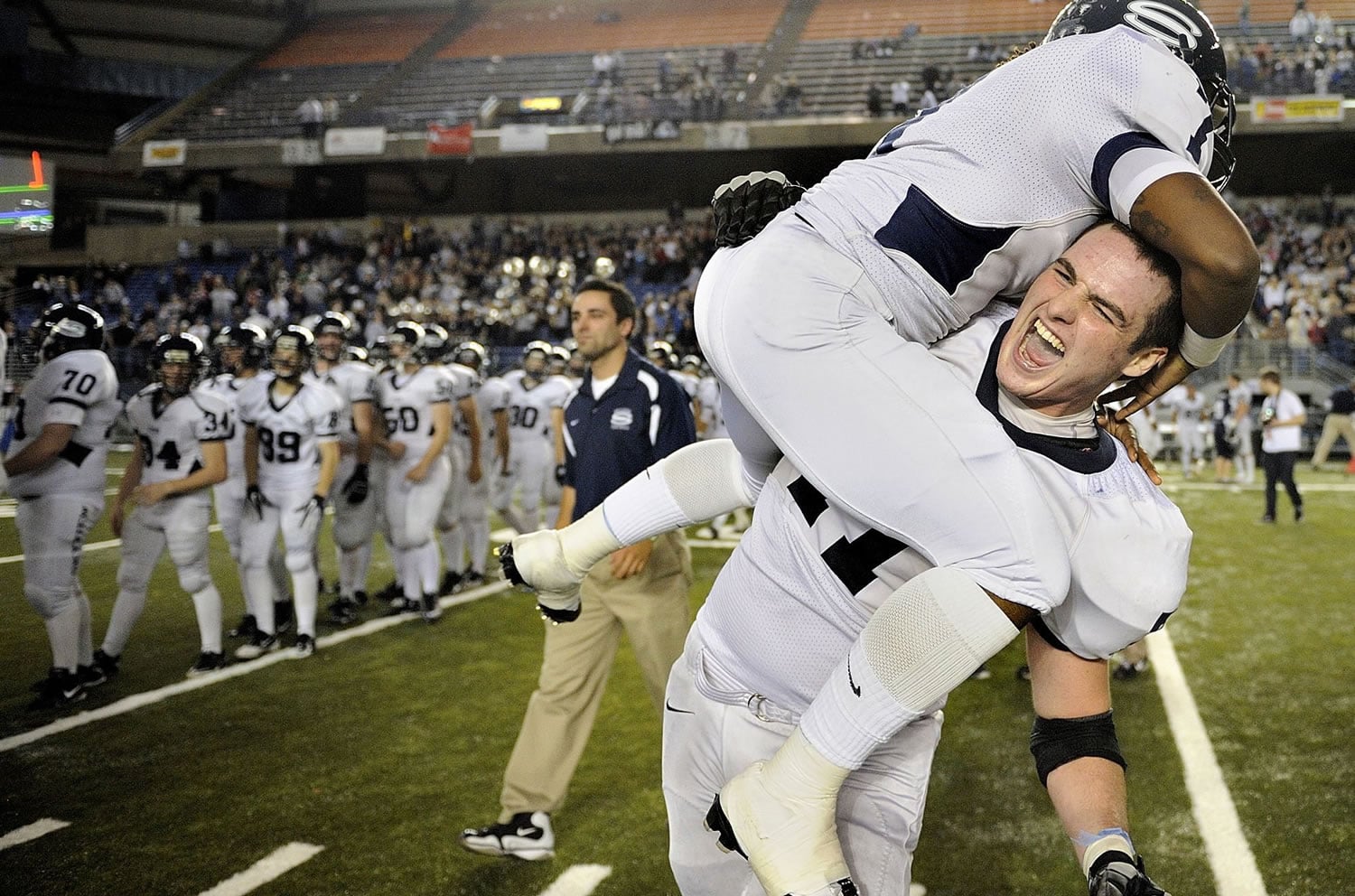 Skyview's Riley Bockmier, giving a lift to C.J.