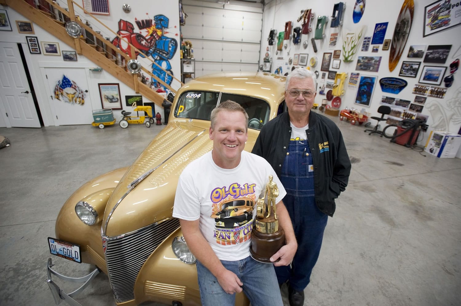 Paul Comeau, left, and his dad Bob Comeau of Comeau Racing, shown with Ol' Gold -- a 1939 Chevrolet sedan.