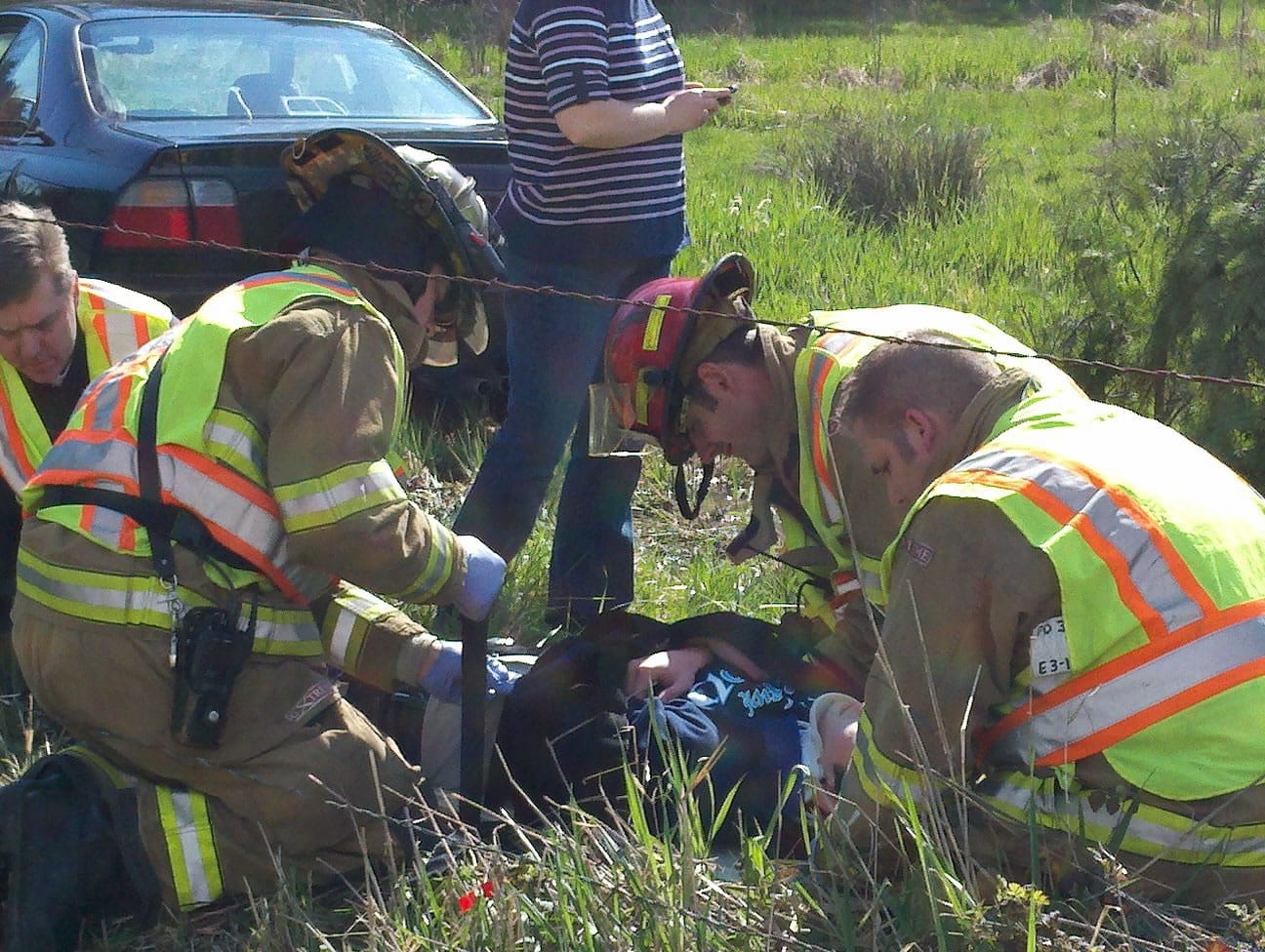 Paramedics work to stabilize a patient injured in a Thursday afternoon auto accident near Hockinson High School.