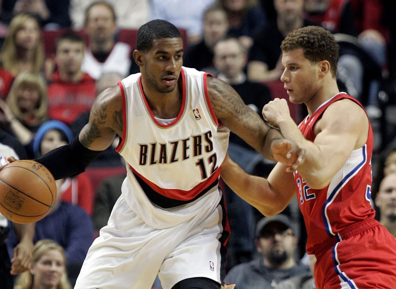 Portland Trail Blazers forward LaMarcus Aldridge, left, tries to move to the basket against Los Angeles Clippers forward Blake Griffin during the first quarter of their NBA basketball game in Portland, Ore., Tuesday, Jan.