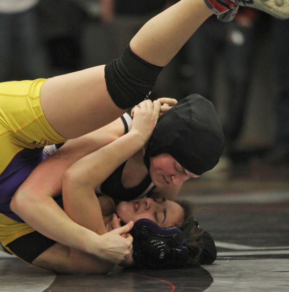 Battle Ground's Hannah Van Osdel (top) pins Columbia River's Sam Schoene for the 137-pound title at the Clark County Championships.