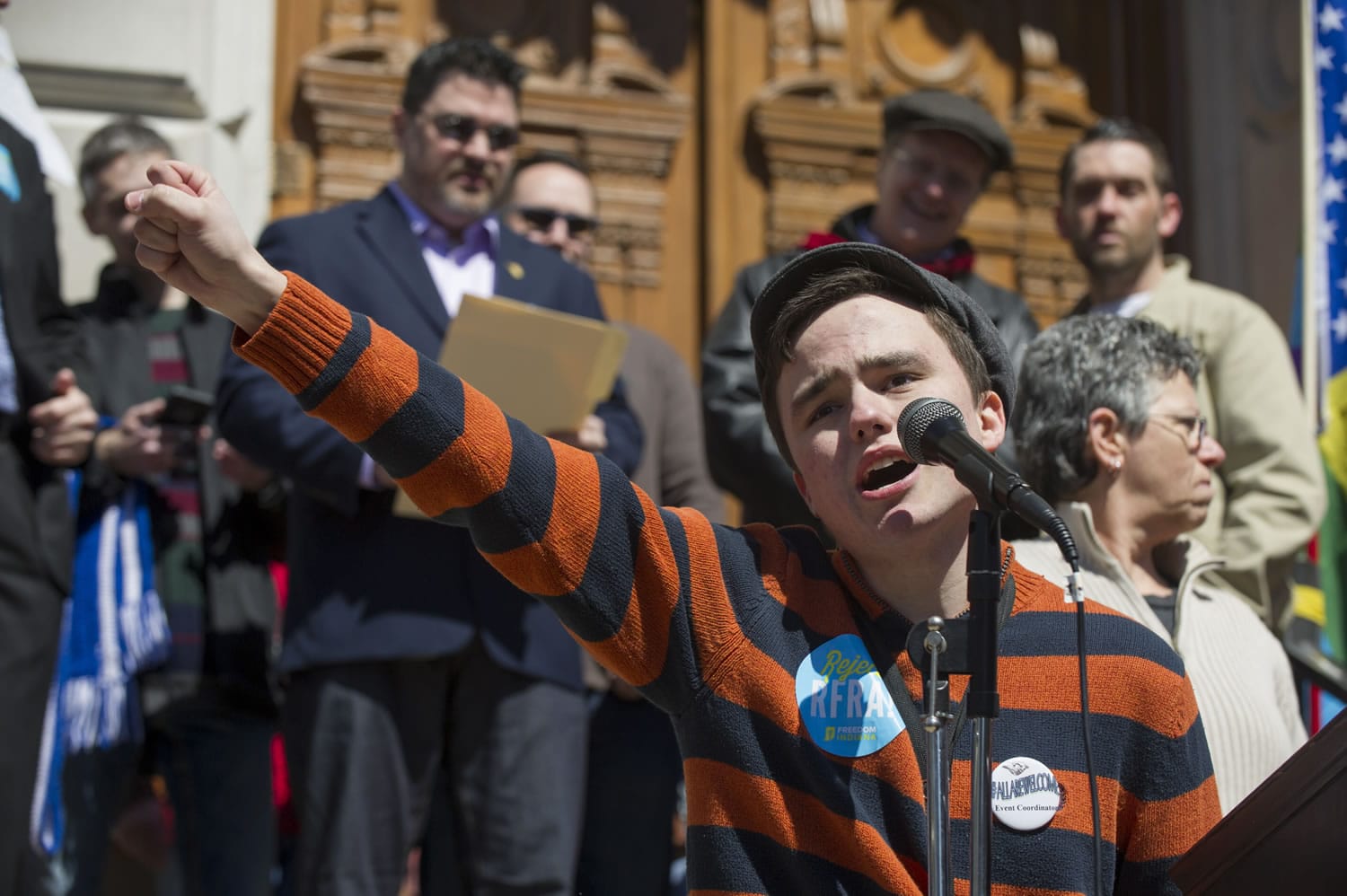 FILE - In this March 28, 2015, file photo, Jackson Blanchard, of Indianapolis, leads the crowd in a chant during a rally against  a new Indiana religious objections law outside the State House in Indianapolis. An intense debate over gay rights already is shaping up in Indiana, where a religious-rights law passed last spring thrust the state into the national spotlight over concerns it could sanction discrimination against gays and lesbians.