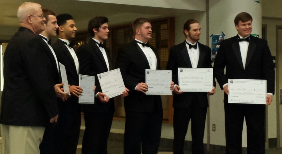 Clark County chapter of the National Football Foundation president Rick Fields poses with 2016 scholarship winners Zach Berfanger, Preston Jones, Liam Fitzgerald, Chris Mitchell, Peter Schultz-Rathbun and Will Ortner.