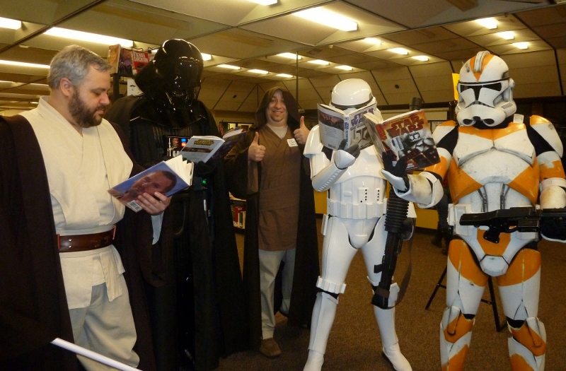Fishers Landing: Jedi Librarian Paul Warner, center, gives a thumbs up to avid &quot;Star Wars&quot; readers Jedi Master Rick Thomas; Darth Vader (David Acheson); Stormtrooper Calvin Smith and Clonetrooper Scott Thingelstad.