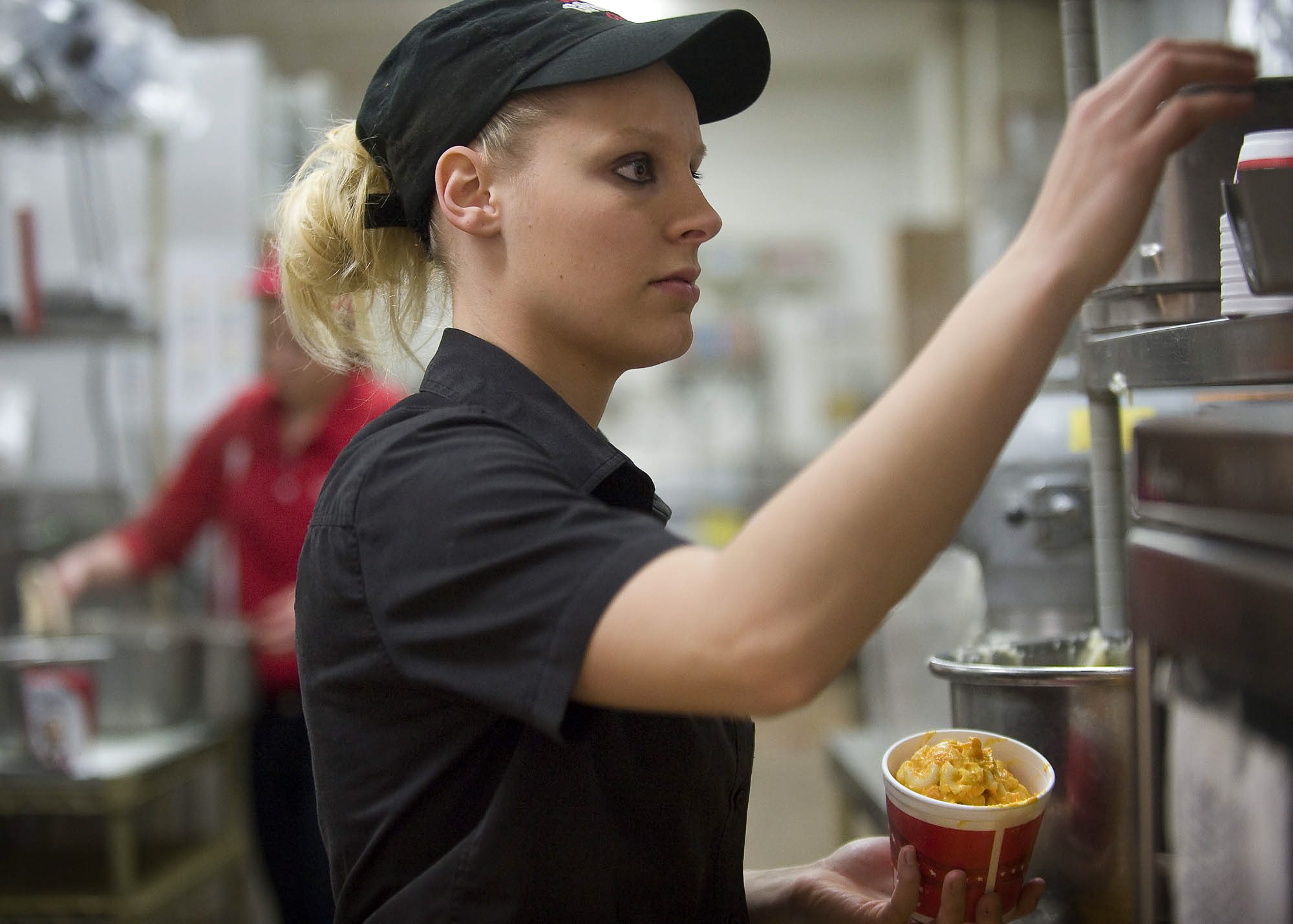 KFC employee Kristie Miles works at the fast-food restaurant in late 2011.