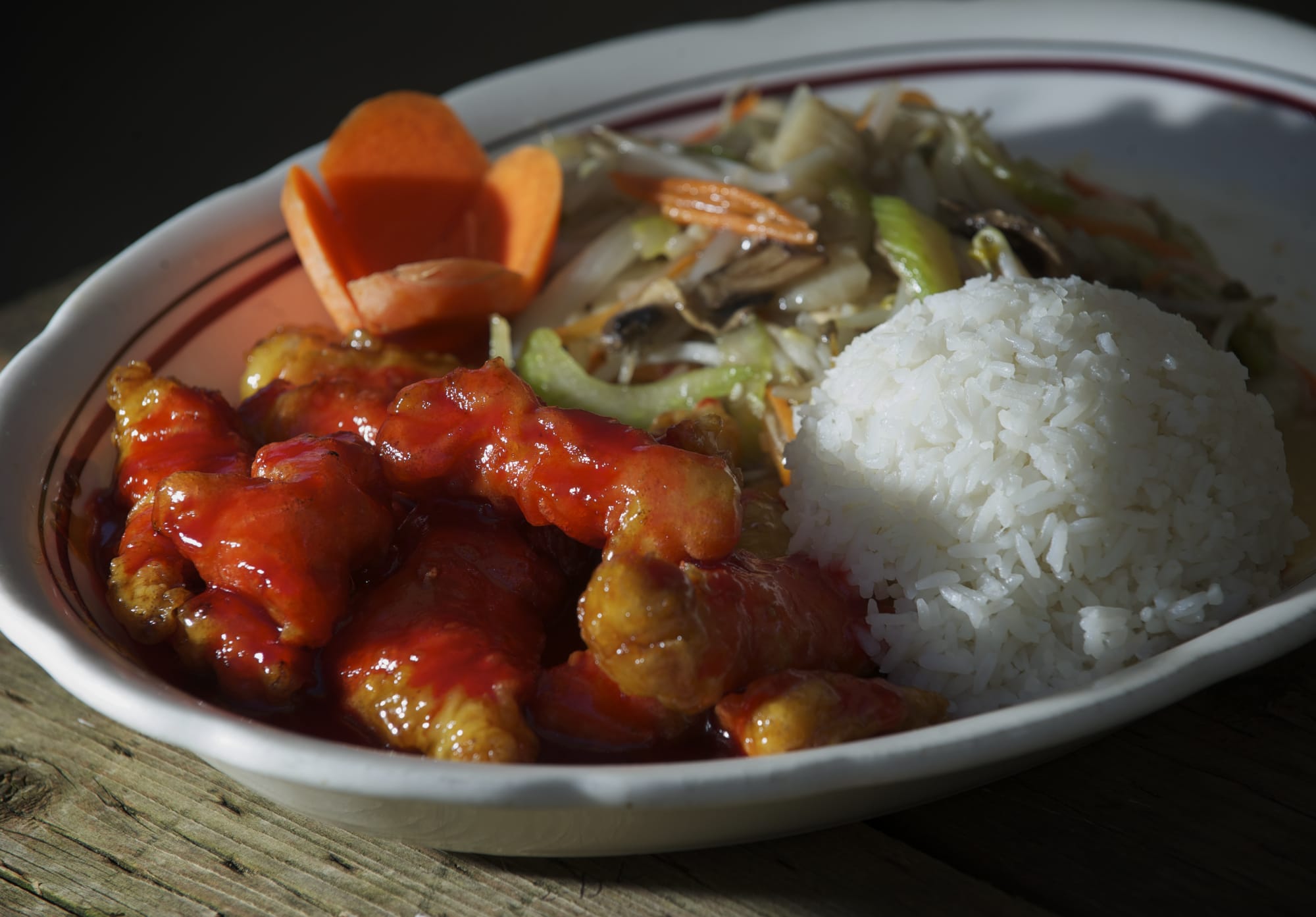 Sweet &amp; Sour Halibut, clockwise from left, Pork Chow Mein and steamed rice are available at Green Tea Kitchen.