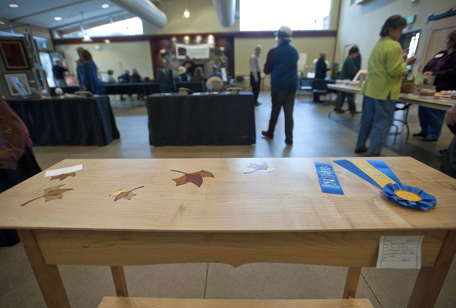 Tom Nichols' table of big-leaf maple and cherry, with exotic-wood insets of leaves, won Best in Show.