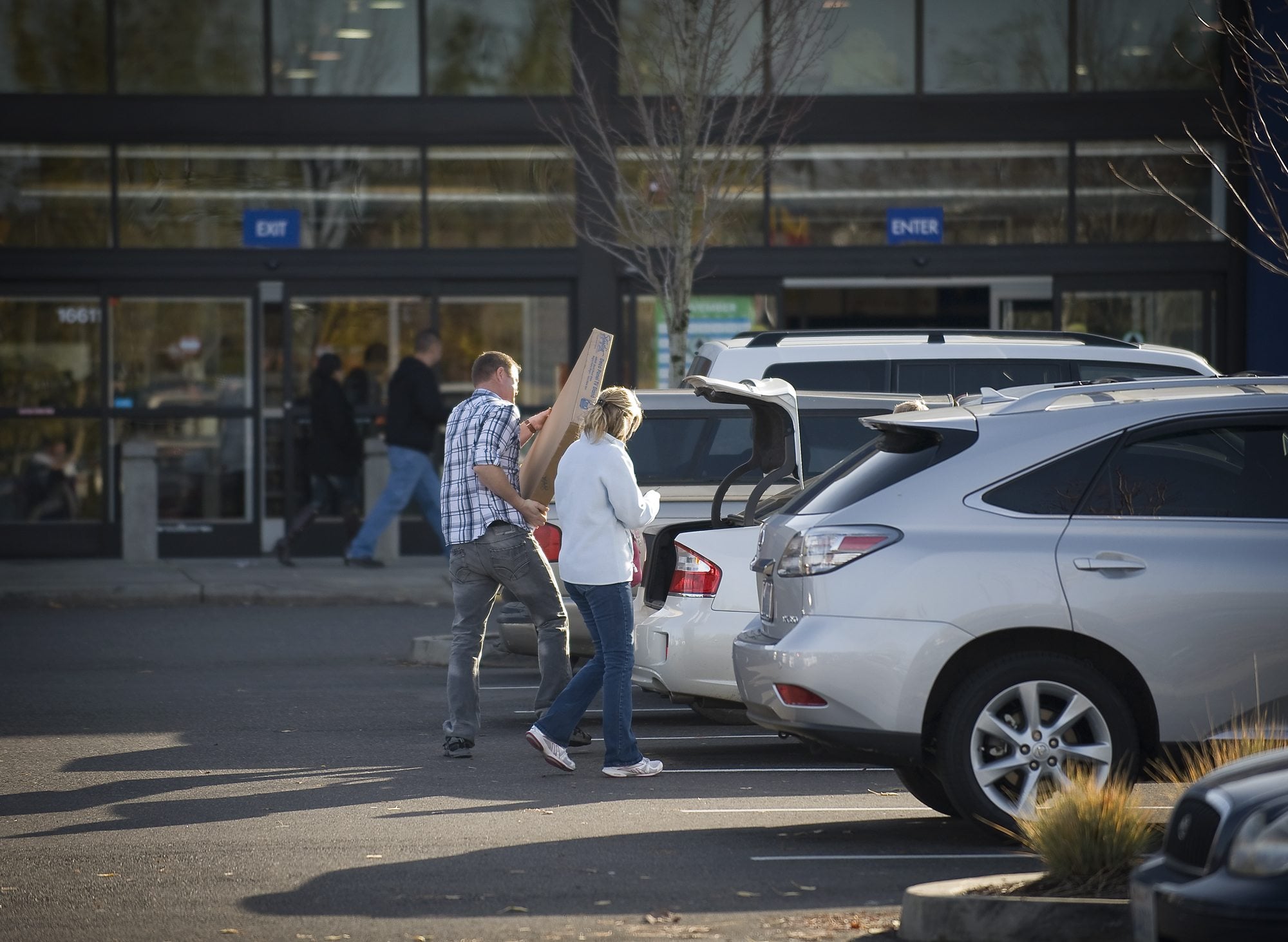 Shoppers load items into their car at Best Buy off of Southeast Mill Plain Boulevard earlier this week.