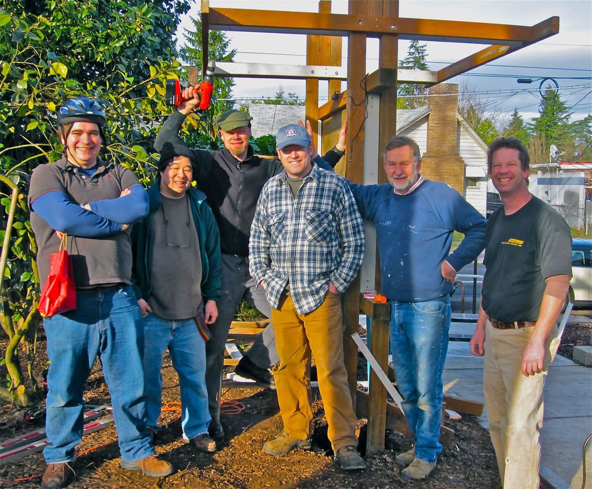 Lincoln: Volunteers -- including, from left, Arvonn Tully, David Tang, Quentin Welch, Sean Evans, Richard Rystrom and Bob Adams -- are building a community bulletin board at Latte Da Coffeehouse and Wine Bar in Vancouver.