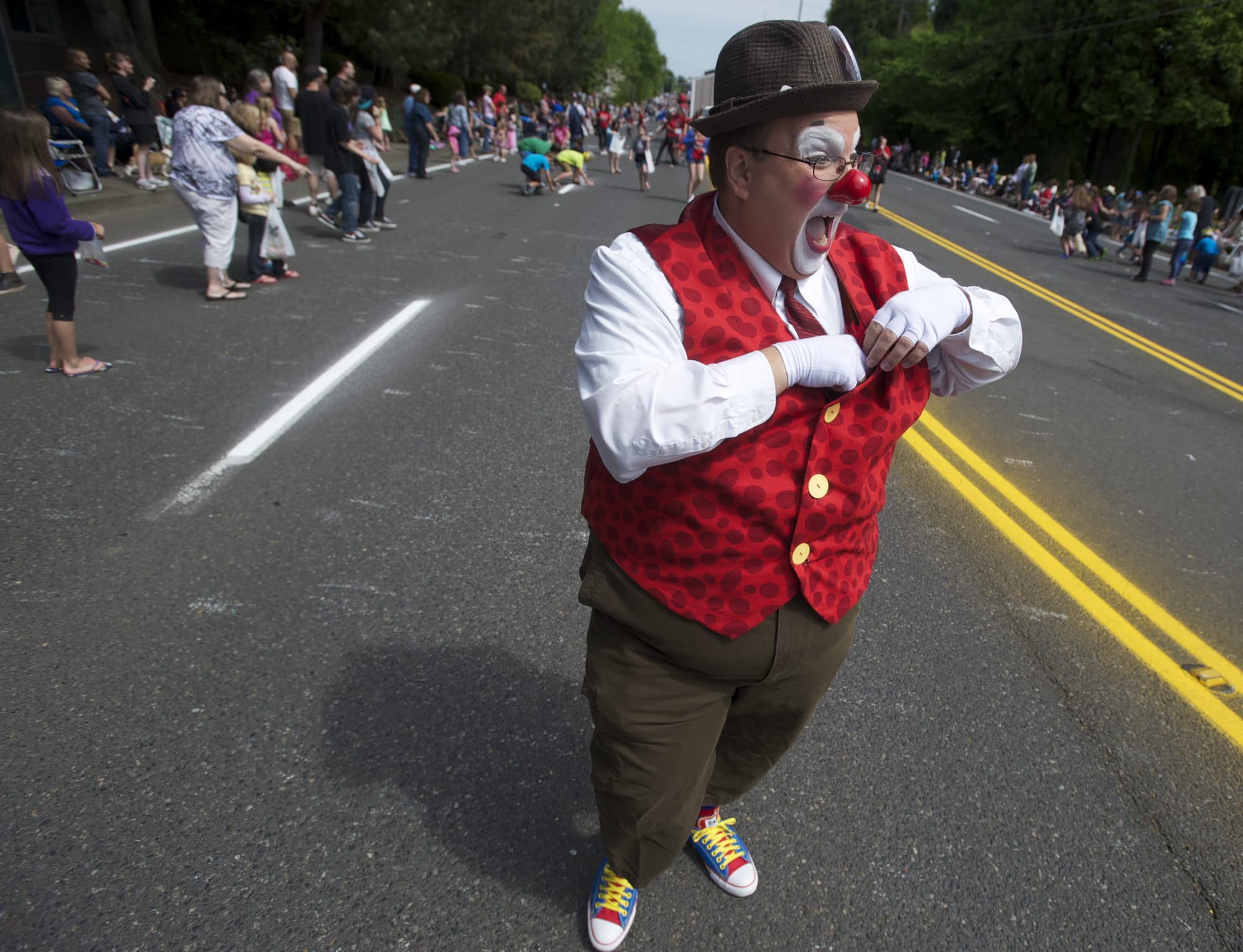 Roosevelt the Clown, otherwise known as Greg Saum of the Rose Festival Clowns, entertained a crowd Saturday at the 48th annual Hazel Dell Parade of Bands.