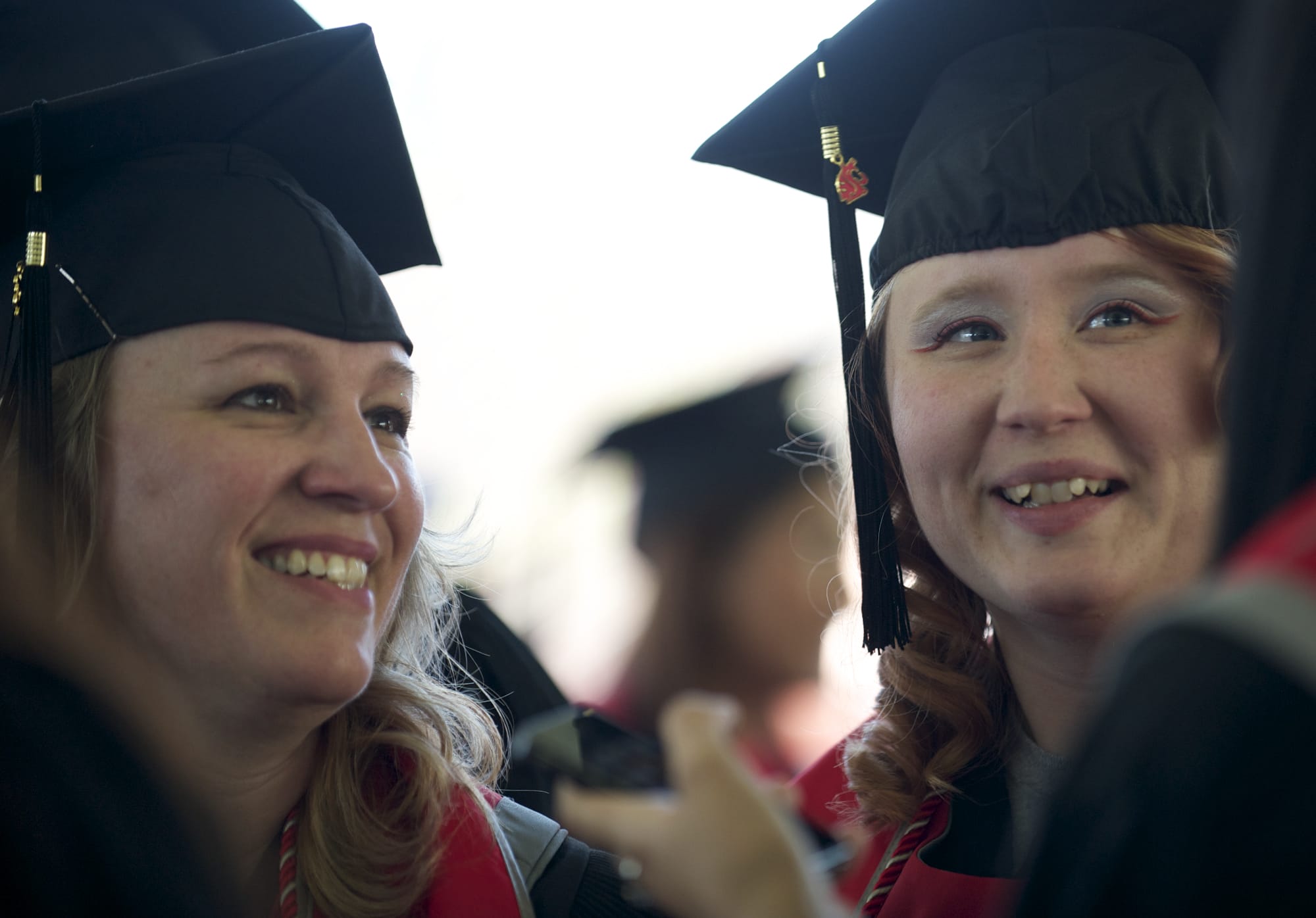 Cheryl Jones and her daughter Cori get ready to walk at Washington State University Vancouver's commencement ceremony Saturday at the Sleep Country Amphitheater.