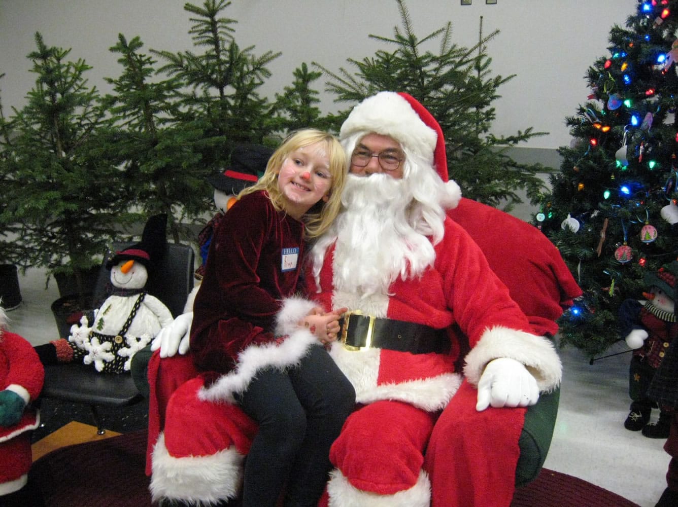 Battle Ground: Infiniti Rivera sits on Santa's lap at a Christmas party for special-education students hosted by the Battle Ground Elks Lodge.