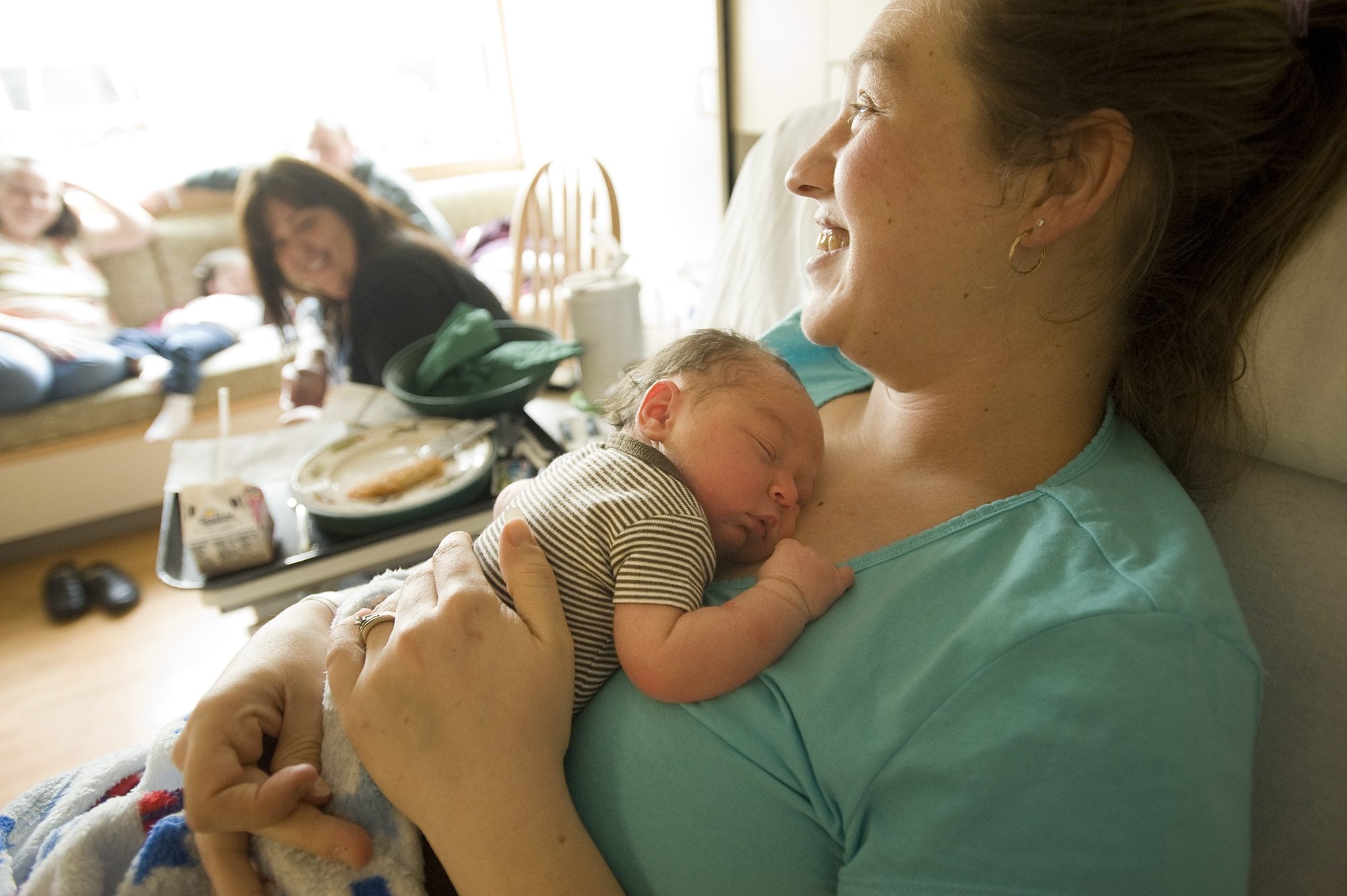 Katherine Thayer holds her newborn son, Noah, in their room at PeaceHealth Southwest Medical Center's Family Birth Center on Wednesday.