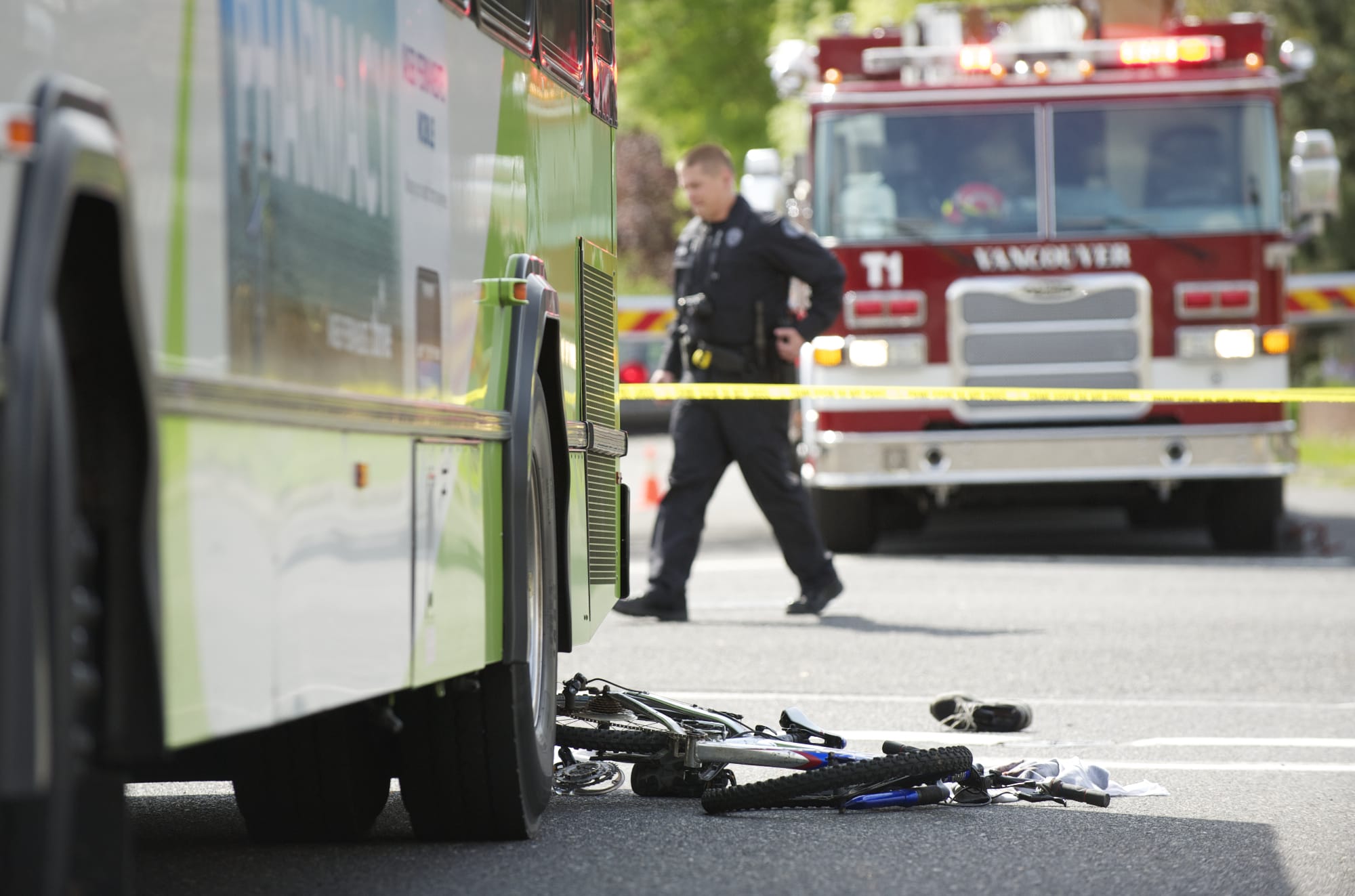 Police investigate an accident where a C-Tran bus collided  with boy on a bike at the intersection of 27th and Main in Vancouver on Saturday.